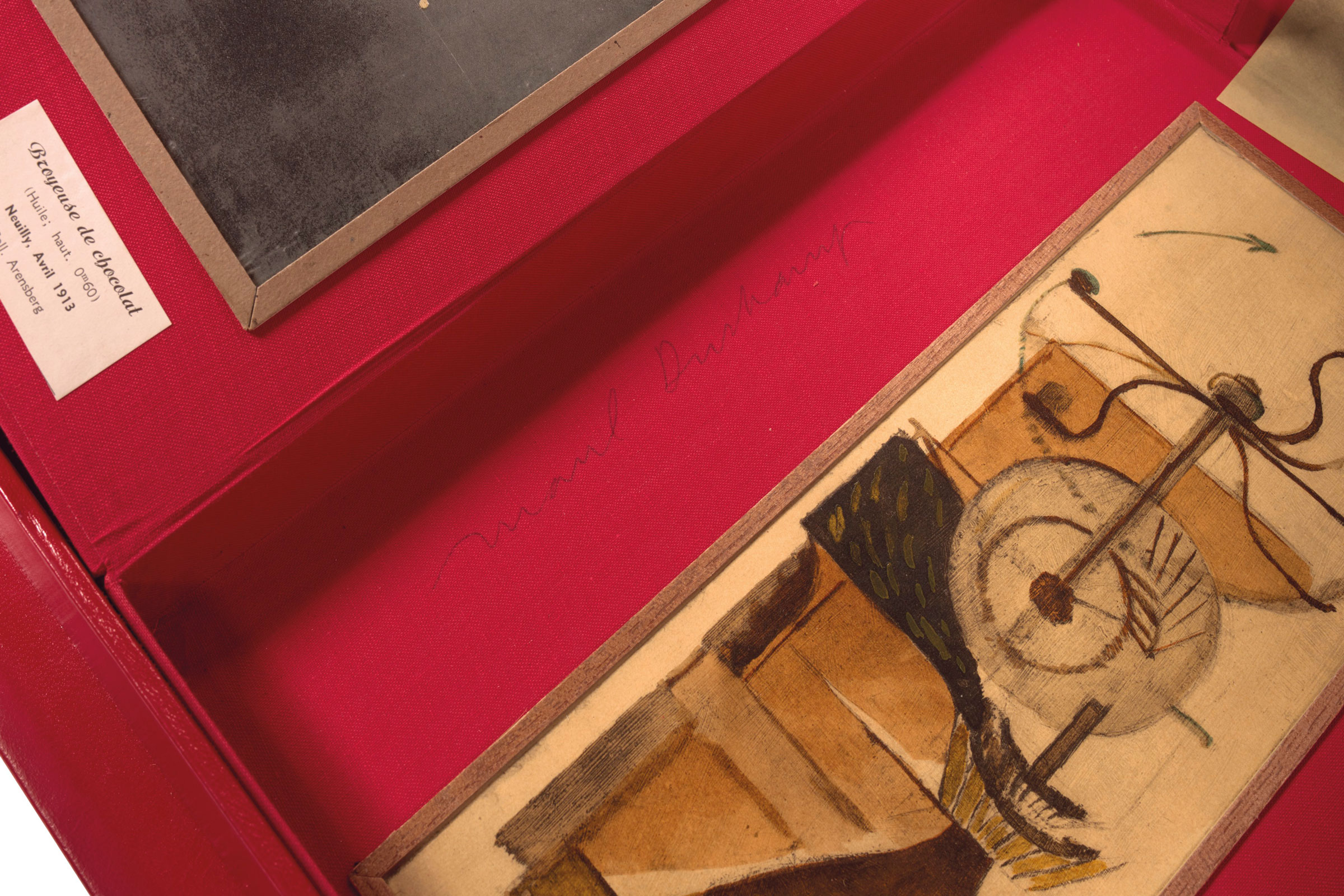Marcel Duchamp’s signature on the red linen finish inside the box