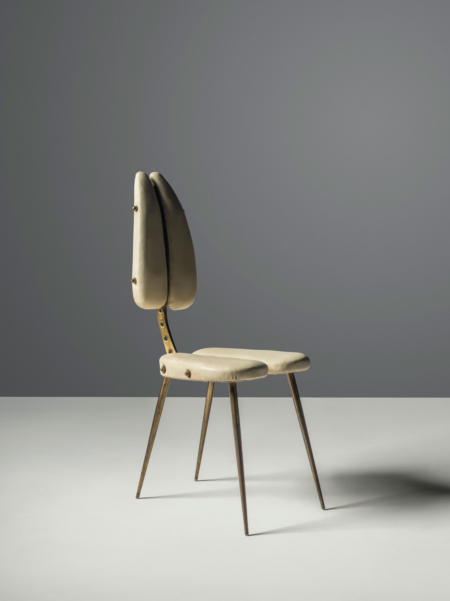 Carlo Mollino (1905-1973), An Important ‘Tipo B’ side chair, 1950. Resinflex, brass, tubular brass. 37⅗ high x 15 wide x 21 in deep (95 x 38 x 53.5 cm). Sold for £518,750 on 17 October 2018 at Christie’s in London