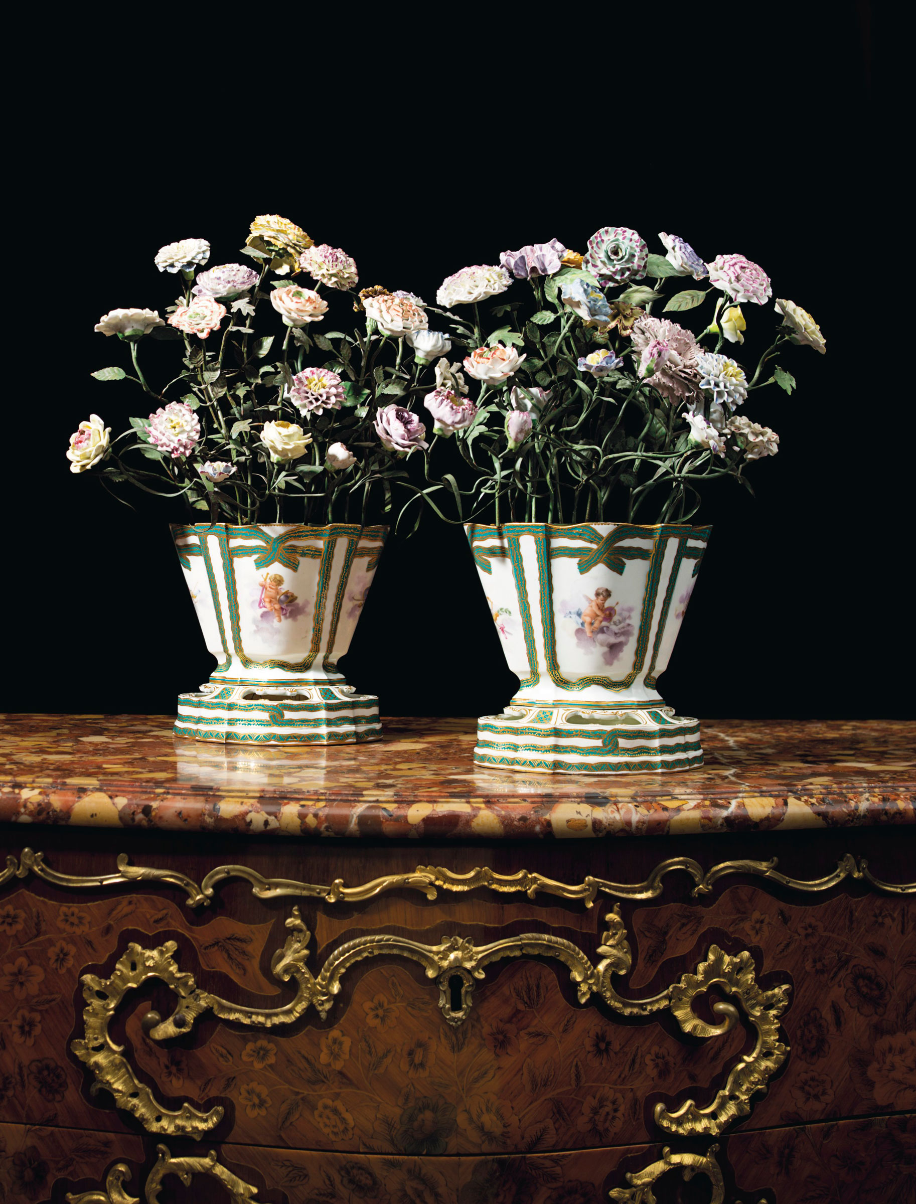 A pair of Sèvres porcelain green-ribboned flower-pots and stands filled with porcelain flowers on tole stems. Estimate: $60,000-80,000. Offered in A Love Affair with France: The Collection of Elizabeth Stafford on 1 November at Christie’s in New York