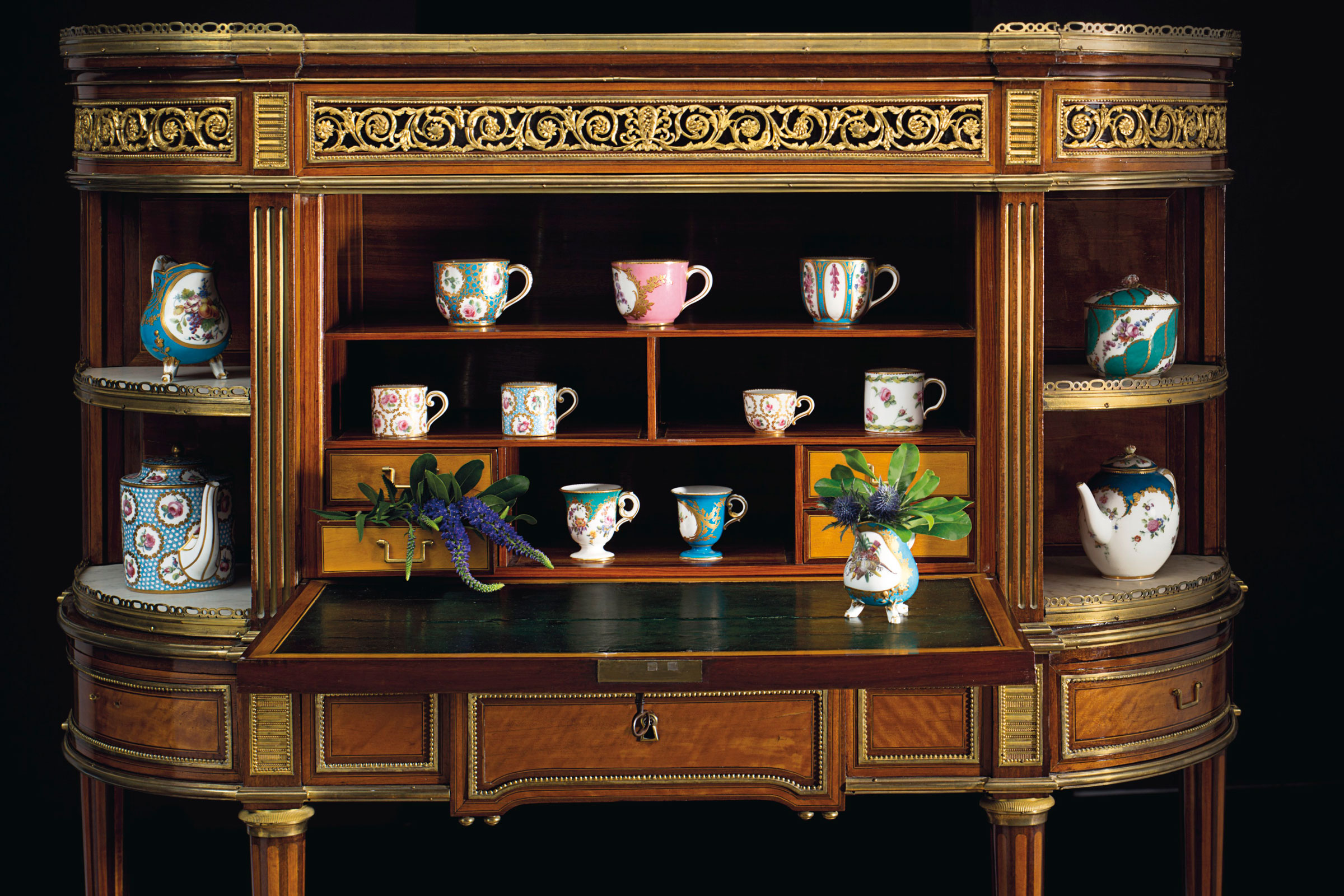 A late Louis XIV ormolu and porcelain-mounted mahogany, amaranth and ebony-strung sécretaire à abbatant, by Nicholas Lannuier, circa 1790. Estimate: $15,000-25,000. Filled with a selection of the Sèvres porcelain in the collection. Offered in A Love Affair with France: The Collection of Elizabeth Stafford on 1 November at Christie’s in New York