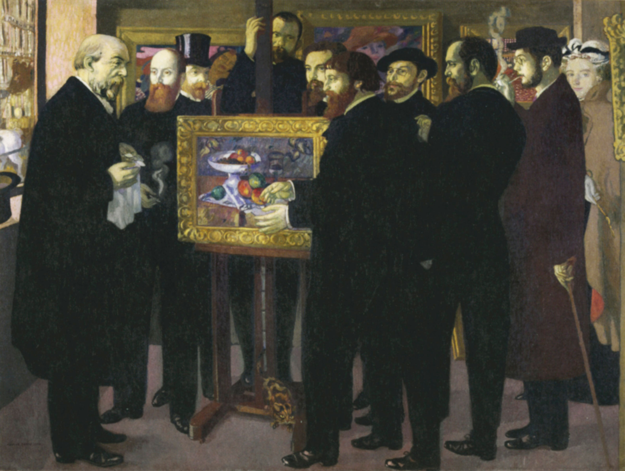 Maurice Denis’ Hommage à Cézanne, 1900-1901, in which the great painter is represented by a still life of a bowl of fruit. Artists and critics crowd round the picture, from left to right: the painters Odilon Redon and Édouard Vuillard, the critic André Mellerio, the art dealer Ambroise Vollard behind the easel, the painters Maurice Denis, Paul Sérusier (in front of the canvas), Paul Ranson, Ker-Xavier Roussel, Pierre Bonnard (smoking a pipe) and Denis’ wife, Marthe. Photo: Musee d'Orsay, Paris