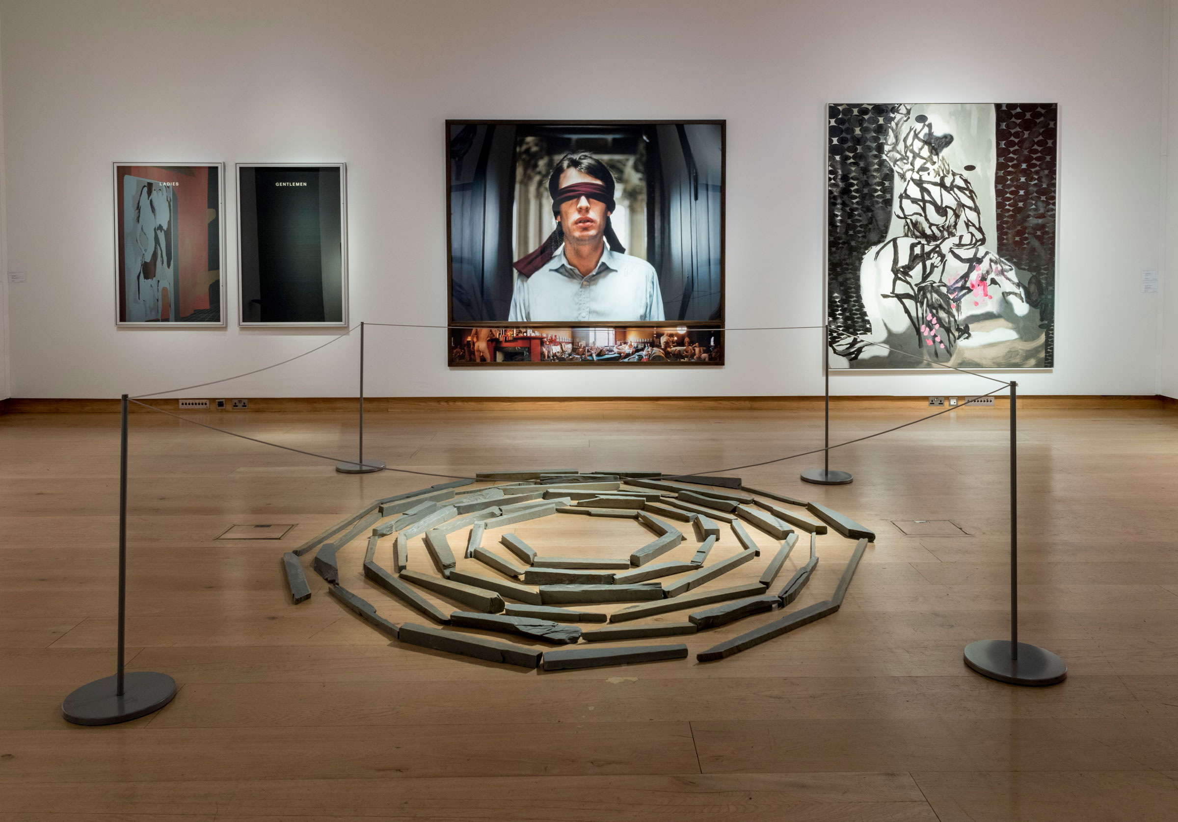 From left: Ladies — Gentlemen by Bethan Huws; Sam Taylor-Johnson’s Soliloquy VIII; and Victorian Water Mains (4th Version) by Toby Ziegler; with Richard Long’s Green Slate Spiral in the foreground