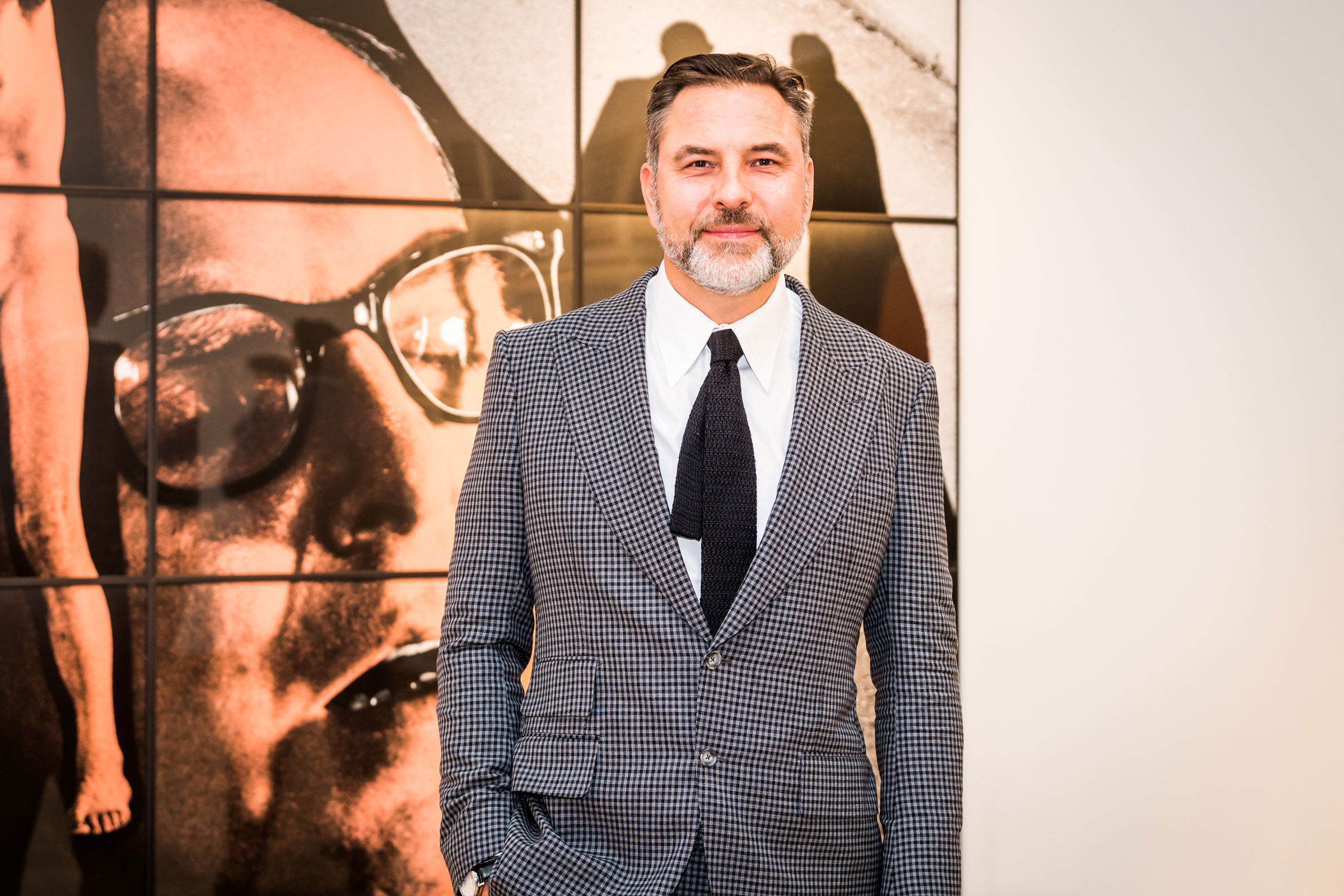 Comedian, author and charity fundraiser David Walliams photographed in front of a Shadow Blind by Gilbert &amp; George