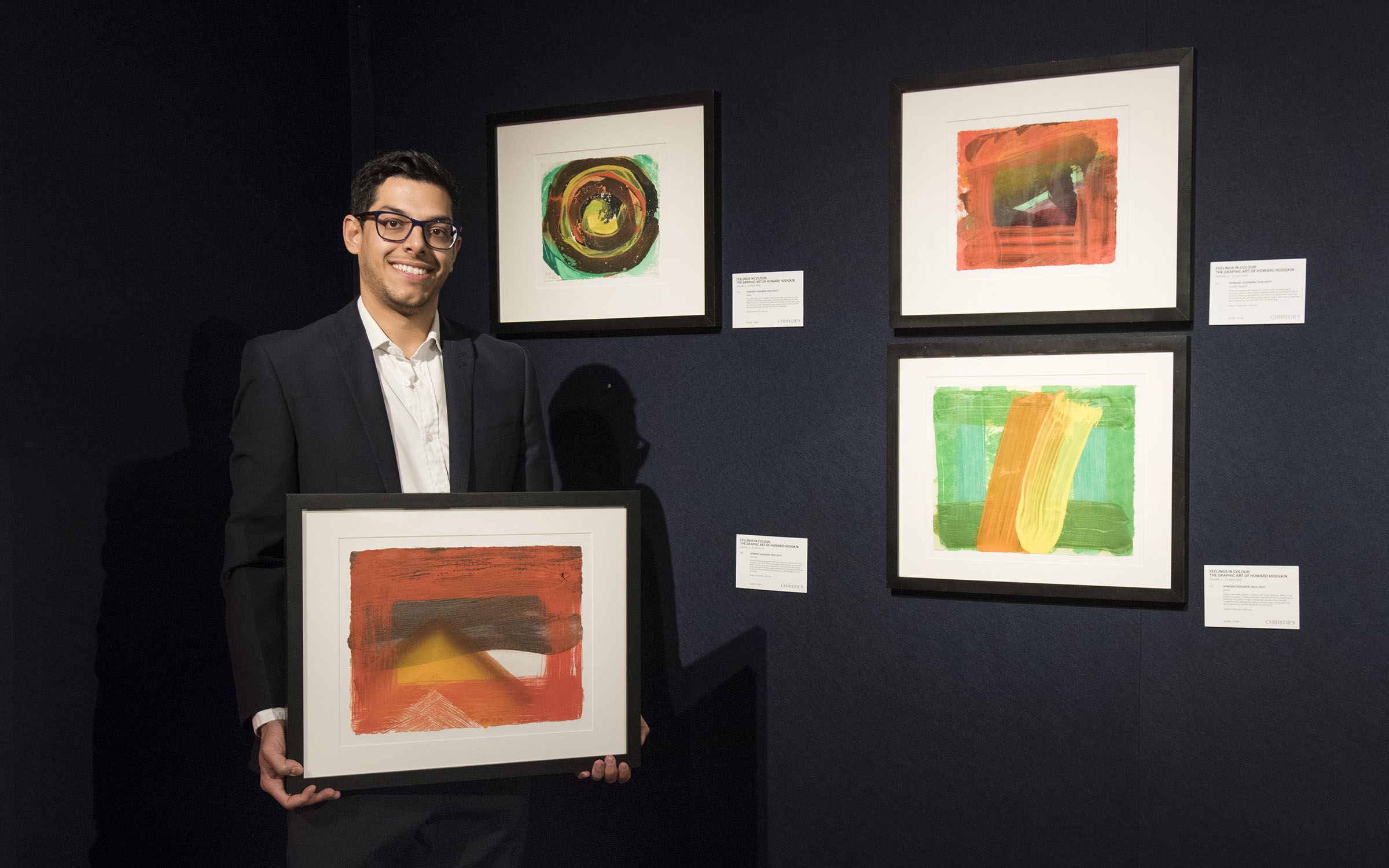 Christie&rsquo;s specialist James Baskerville holding Snow (1995) alongside works offered at Christies&rsquo;s in April 2019. Artworks: &copy; Howard Hodgkin
