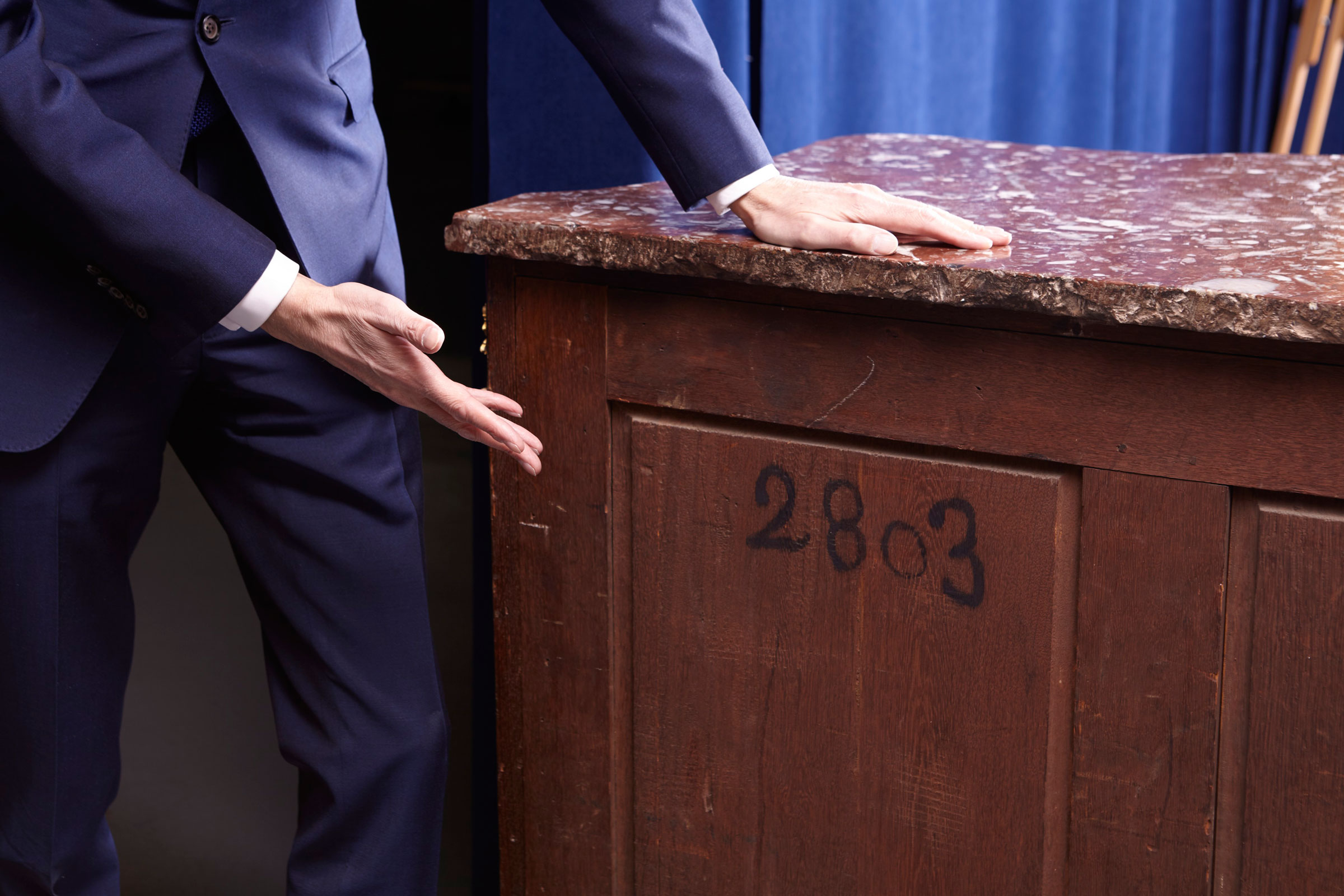 The painted inventory number on the reverse of the Riesener commode is identified in a number of documents held in the French National Archives