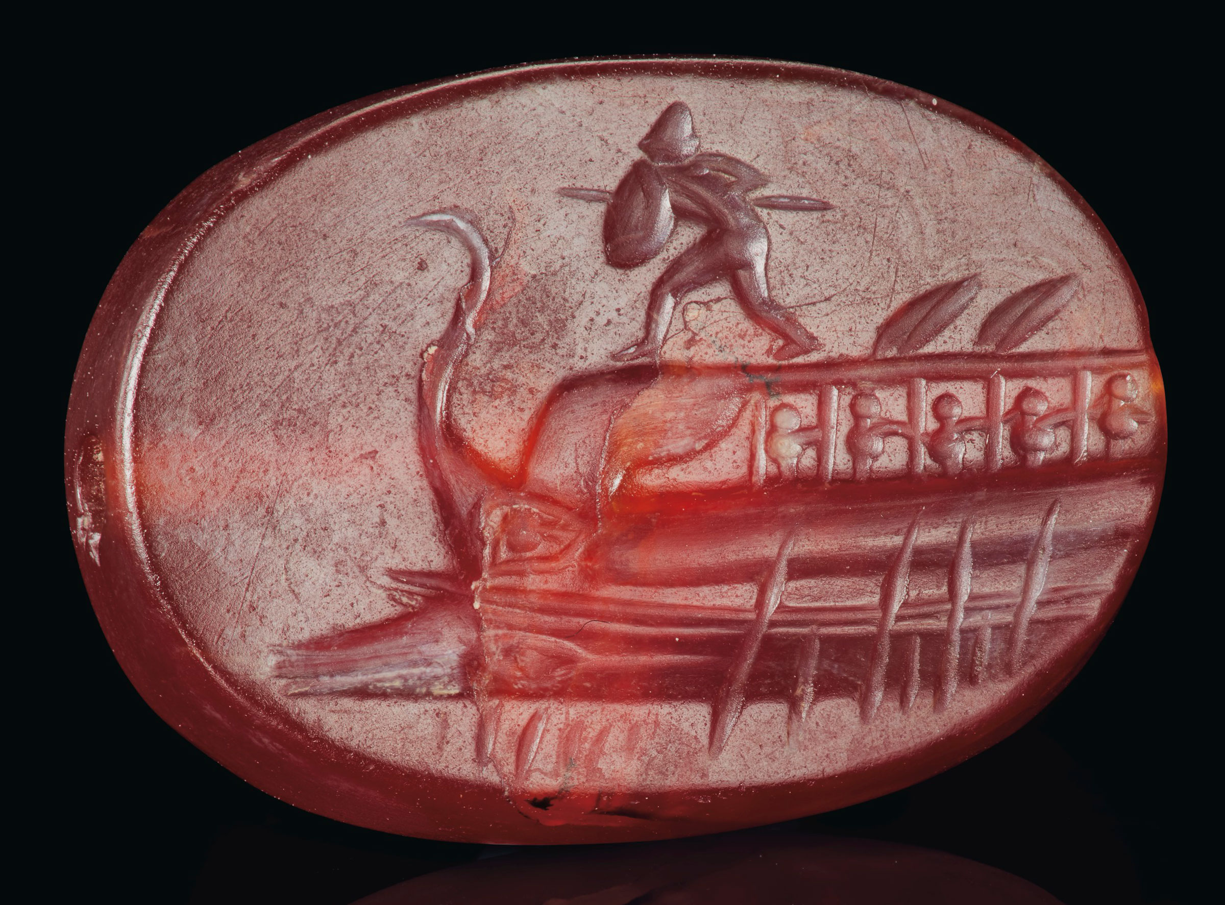 A Greek carnelian scaraboid with Protesilaos, Classical period, circa 4th century BC. 7/8  in (2.2  cm) long. Sold for $325,000 on 29 April 2019 at Christie&rsquo;s in New York