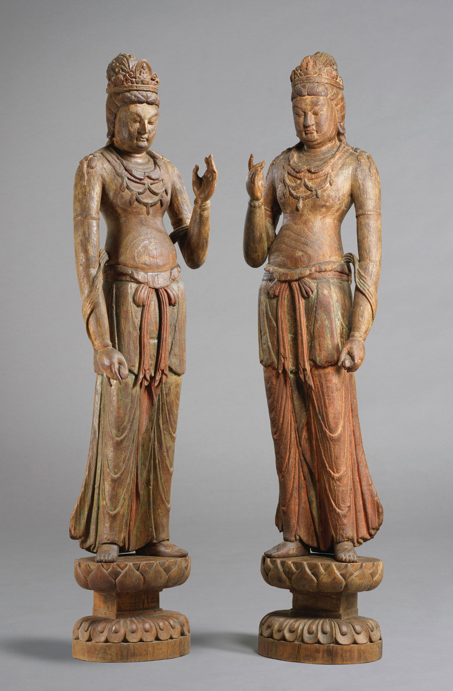 A highly important majestic pair of wood figures of standing bodhisattvas, Five Dynasties-Northern Song Dynasty, 10th-11th century. Avalokitesvara: 56¾ in (144 cm) high; overall height including stand: 67½ in (171.5 cm) high. Mahasthamaprapta: 57⅛ in (145 cm) high; overall height including stand: 68⅛ in (173 cm) high. Estimate: HK$40,000,000-60,000,000. Offered in Glories of Buddhist Arts on 29 May 2019 at Christie’s in Hong Kong