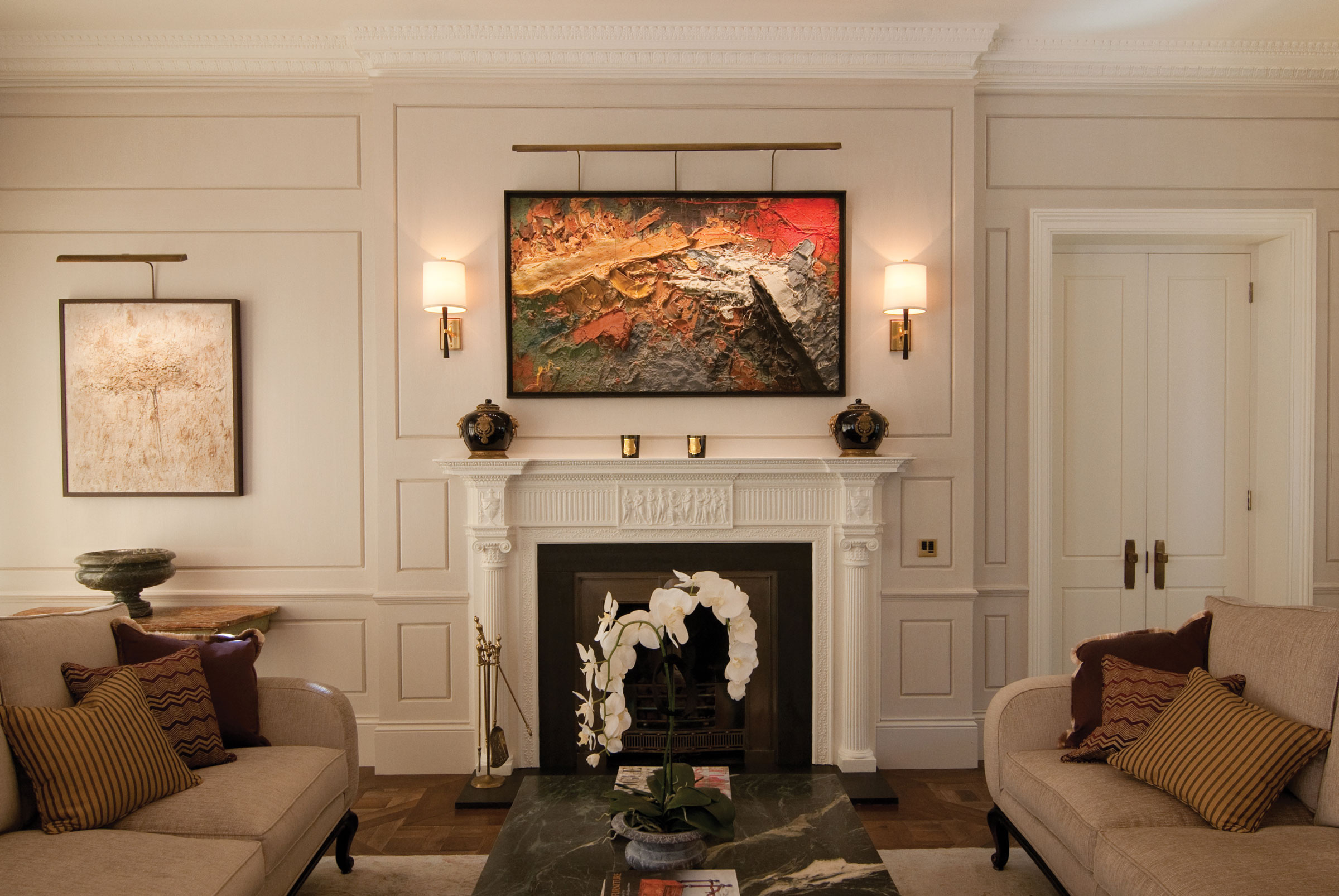 TM Lighting was commissioned to install picture lighting in a show flat in Knightsbridge. It was crucial that each artwork was shown in its best light, as it would be in a gallery. The company matched its picture lights to the antique brass finishes in the rest of the flat