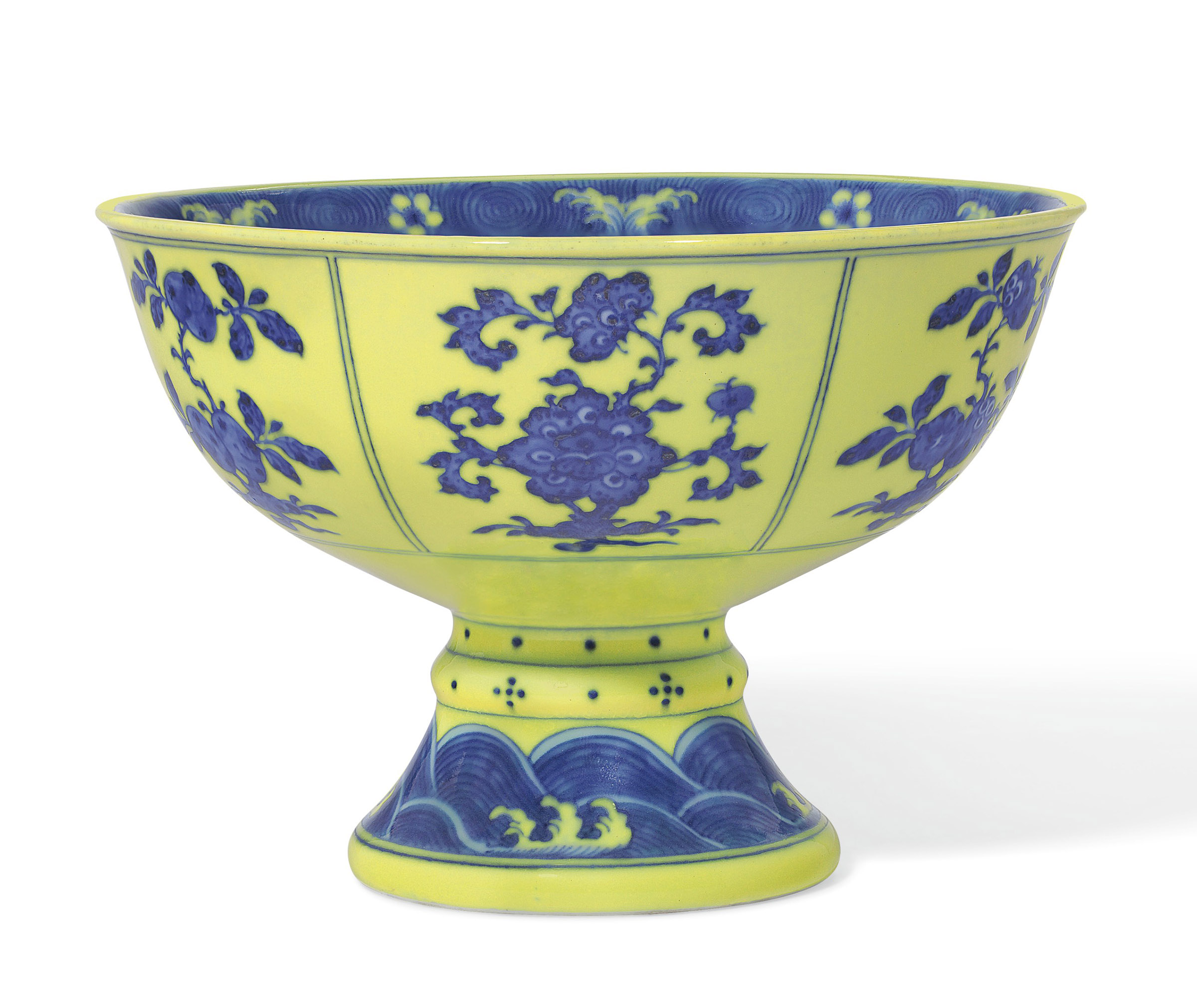 A very rare underglaze-blue-decorated yellow-enameled stem bowl. Qianlong six-character seal mark in underglaze blue in a line and of the period (1736-1795). Diameter 7  in (17.8  cm). Estimate: $100,000-150,000. Offered in Chinese Art from The Art Institute of Chicago  on 12 September 2019 at Christie’s in New York