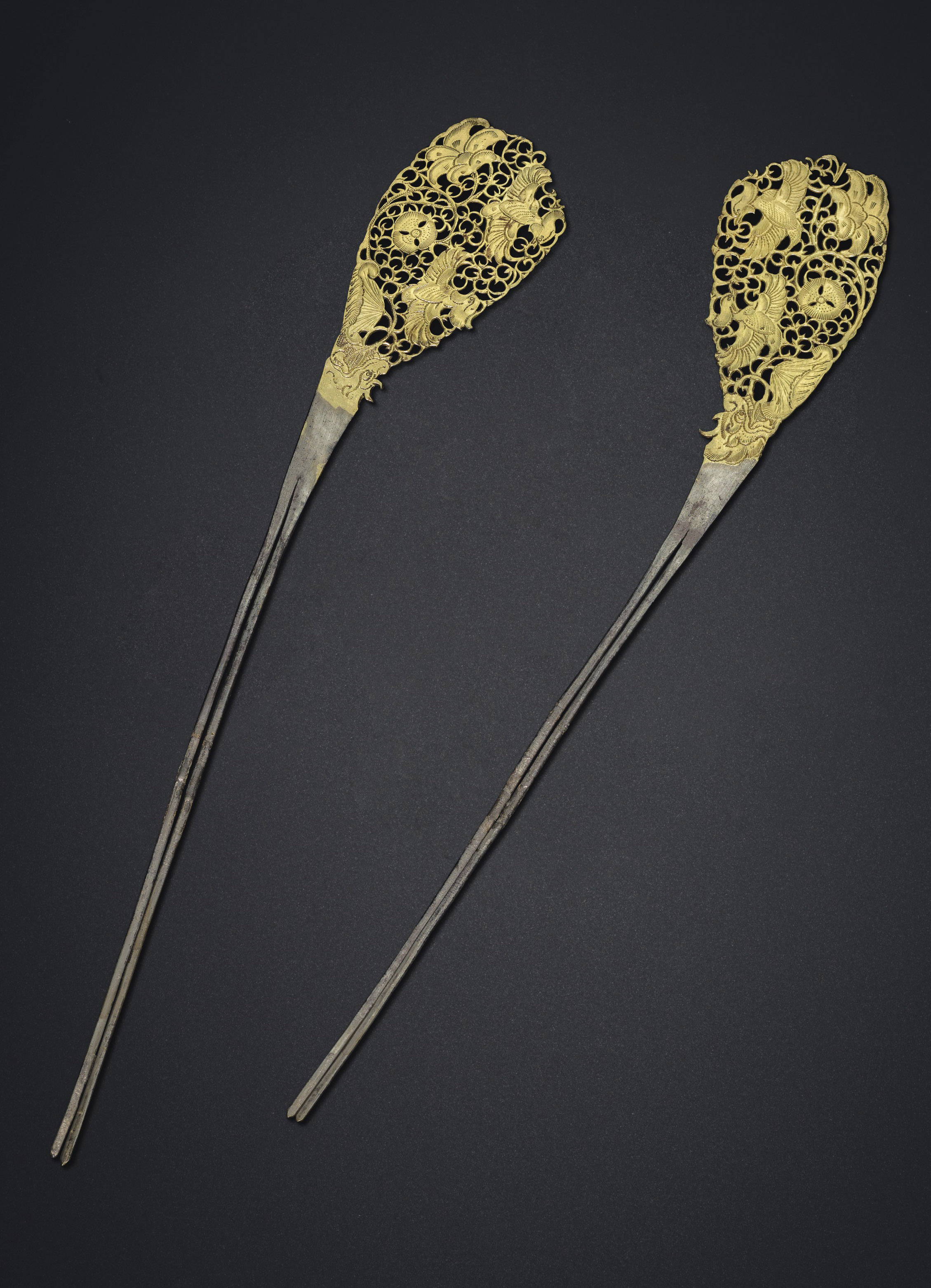 A rare pair of parcel-gilt silver hairpins, Tang dynasty (AD 618-907). Each 11  in (28  cm) long. Estimate: $40,000-60,000. Offered in Masterpieces of Early Chinese Gold and Silver on 12 September 2019 at Christie&rsquo;s in New York