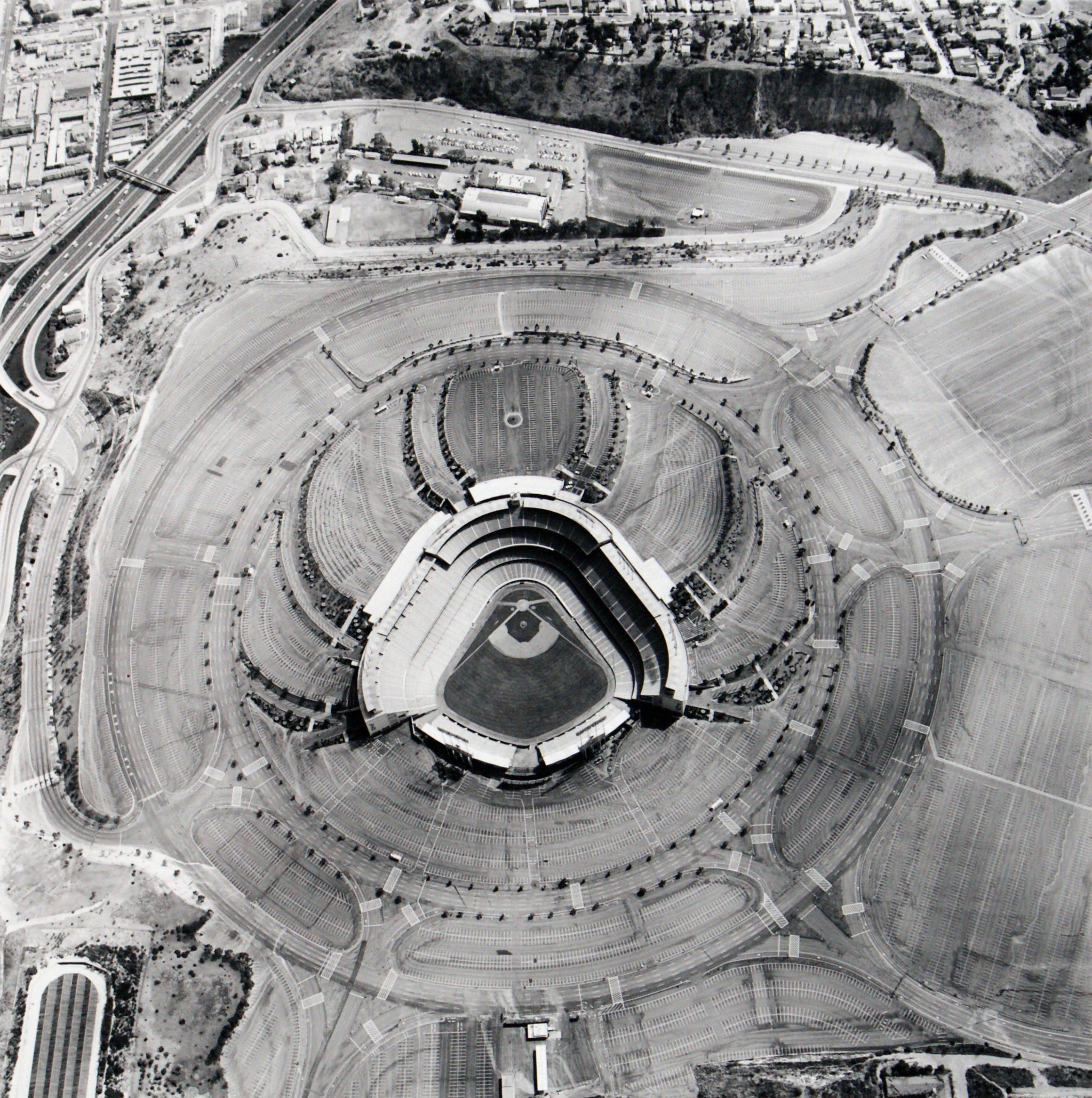 Ed Ruscha, Parking Lots: Dodgers Stadium, 1000 Elysian Park Ave, 1967. Gelatin silver print, 15½ x 15½ in (39.4 x 39.4 cm). Edition of 35. ©Ed Ruscha. Courtesy of the artist and Gagosian