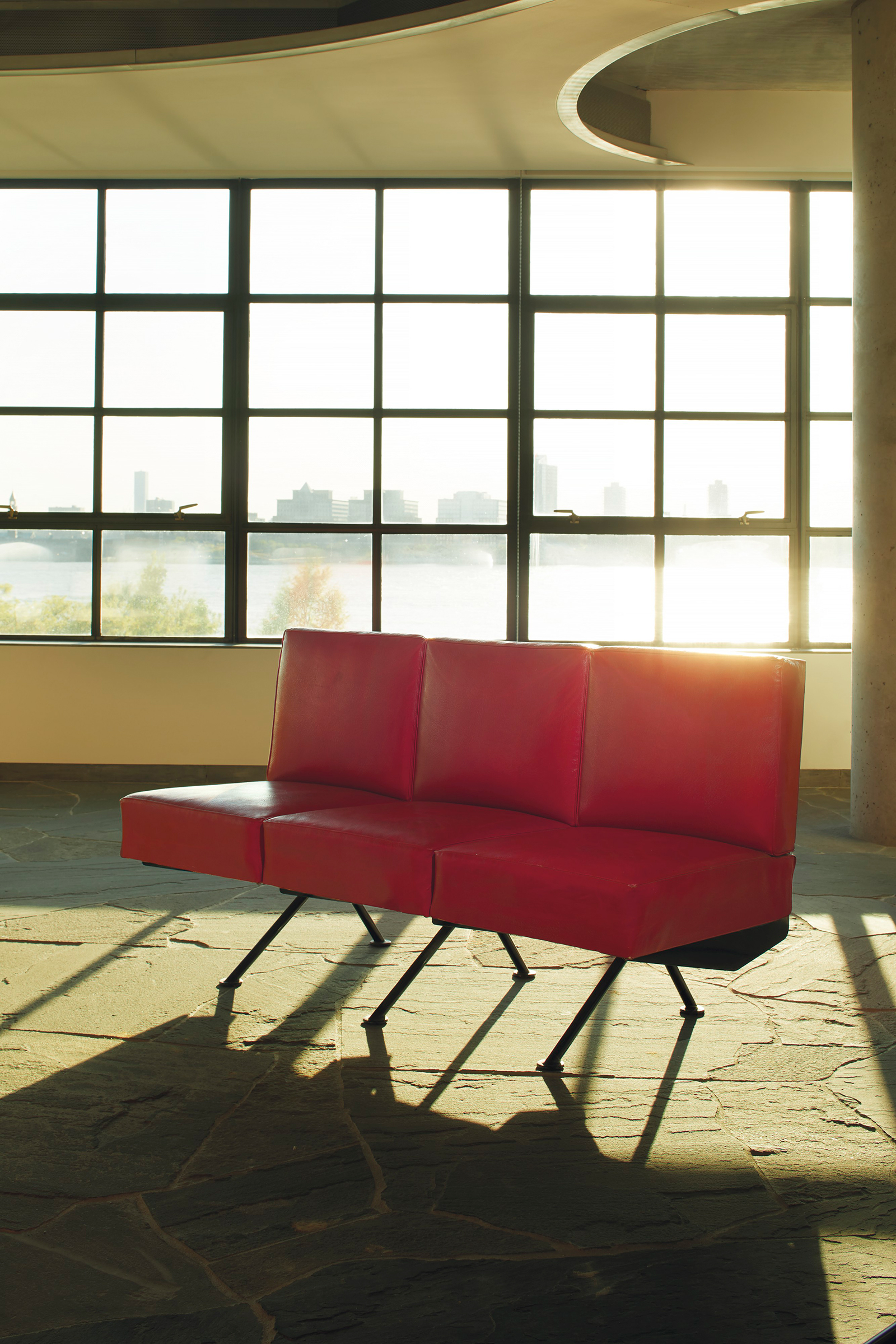 Jean Prouv&eacute; (1901-1984), &lsquo;Banquette&rsquo; no. 356, circa 1954. Painted steel, original leather upholstery.&nbsp;32&frac12; in (85.6 cm) high; 59⅜ in (150.8cm) wide; 26&frac34; in (68cm) deep. Estimate: $50,000-70,000. Offered in Design on 13 December at Christie&rsquo;s in New York

