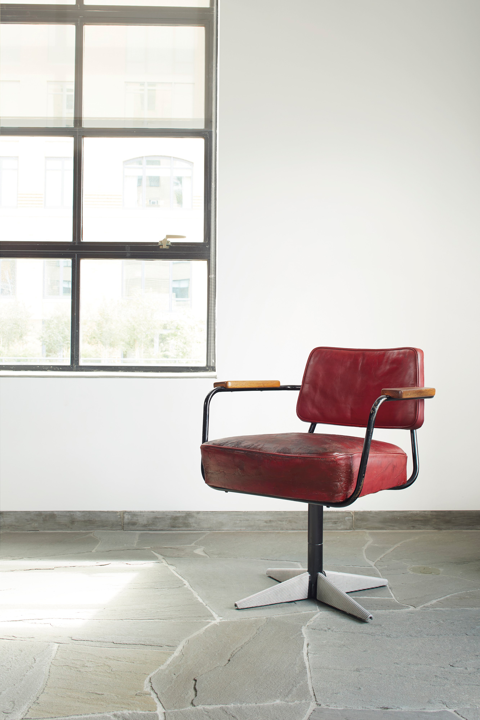 Jean Prouv&eacute; (1901-1984) &lsquo;Direction&rsquo; model no.353 Swivel Chair,&nbsp;circa&nbsp;1951. Painted steel, diamond point sheet aluminium, original leather upholstery, oak. 28&frac34; in (73 cm) high; 26&frac12;&nbsp;in (67.3 cm) wide; 24&frac12; in (62.2 cm) deep. Estimate: $50,000-70,000. Offered in Design on 13 December at Christie&rsquo;s in New York.

