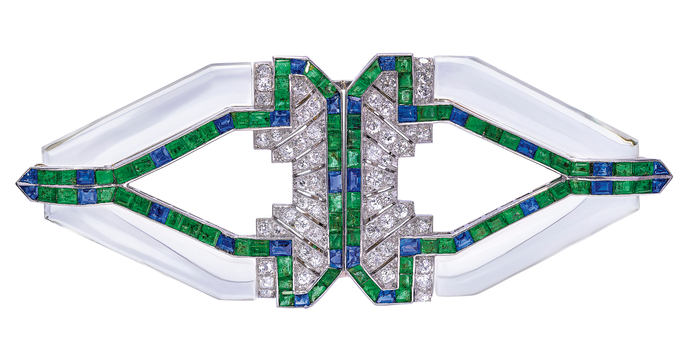 Raymond Yard, Art Deco rock crystal, emerald, sapphire and diamond double clip brooch, 1930s. Rock crystal, calibré-cut emeralds and sapphires, old-cut diamonds, detachable to wear as two clip brooches, 9.0 cm. Sold for CHF 30,000 on 12 November 2019 at Christie’s in Geneva