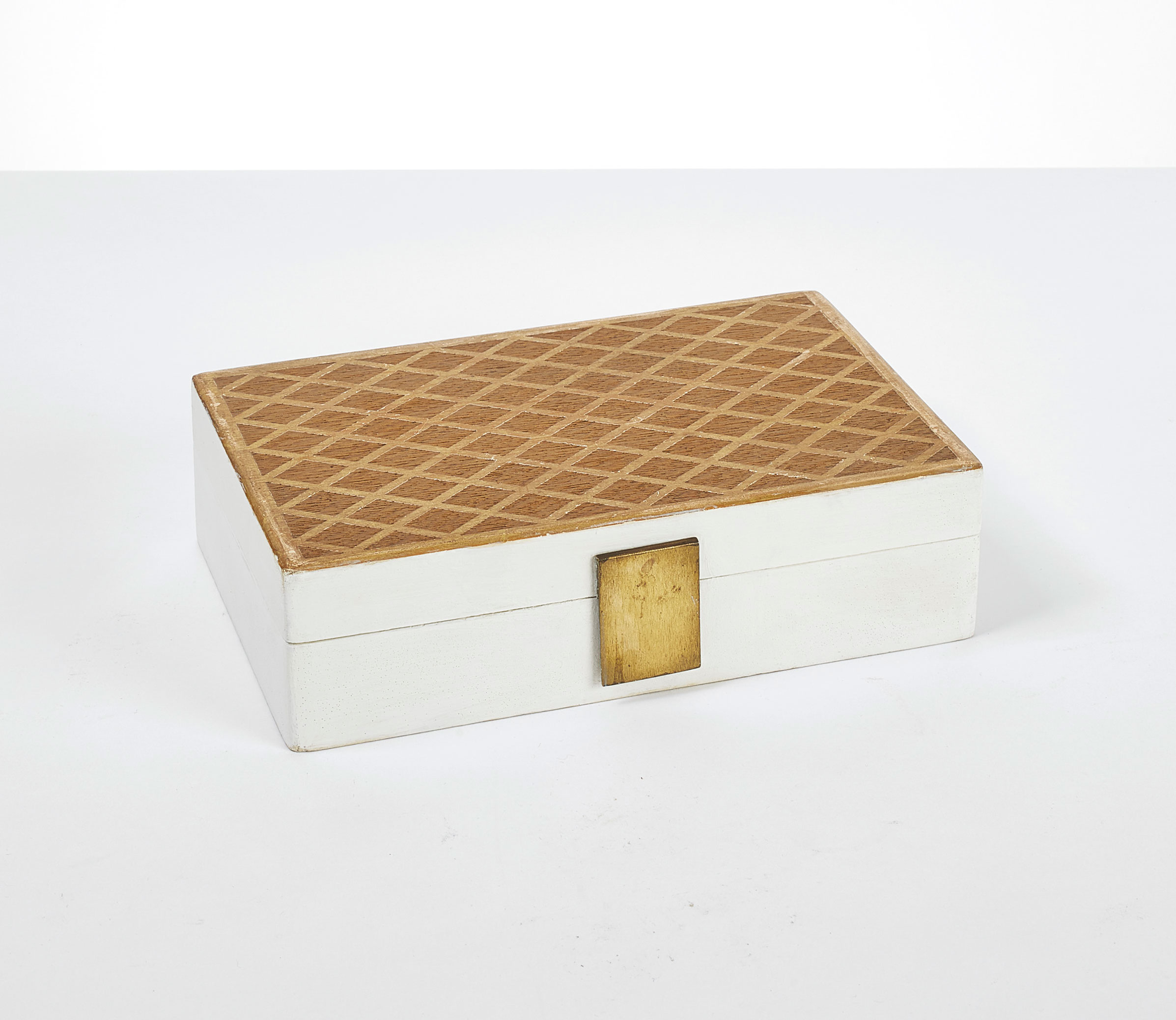 Jean-Michel Frank (1895-1941) for Guerlain (Founded in 1828), Perfume box, circa 1935. Painted oak, sandblasted and gilded, brass and satin / painted, gilt and sanded oak, brass and silk. 6 x 21 x 13.5 cm / 2⅜ x 8 ¼ x 5 ¼ in. Sold for €6,875 on November 19 2019 at Christie’s in Paris