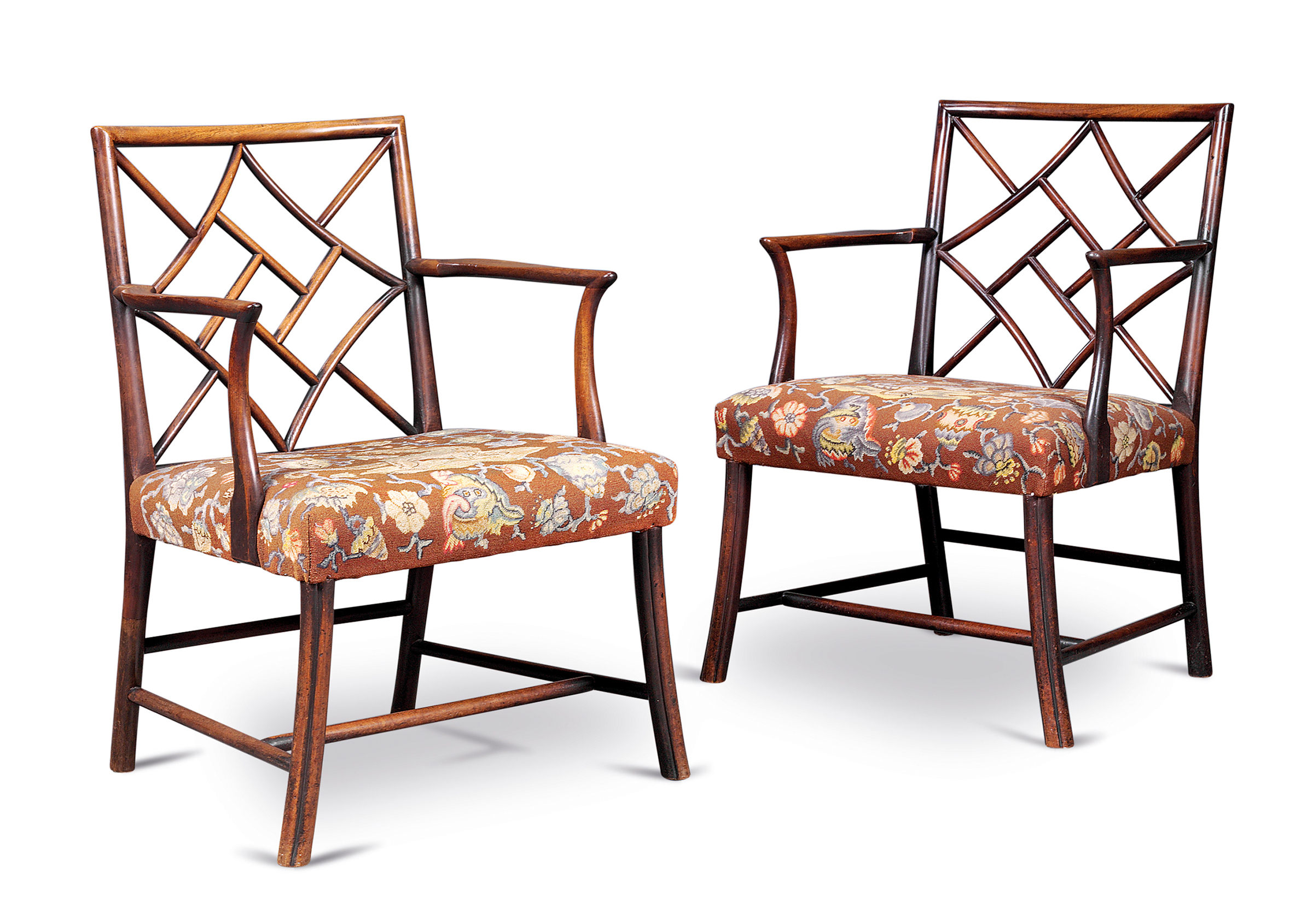 A pair of George III mahogany cockpen armchairs, circa 1760, possibly Scottish, the needlework by H.R.H. the Duchess of Gloucester, later Princess Alice (1901-2004). 34¾ in (88  cm) high; 24 in (61 cm) wide; 22¾ in (58 cm) deep. Estimate: £5,000-8,000. Offered in Property from Descendants of Their Majesties King George V and Queen Mary on 13 December 2019 at Christie’s in London