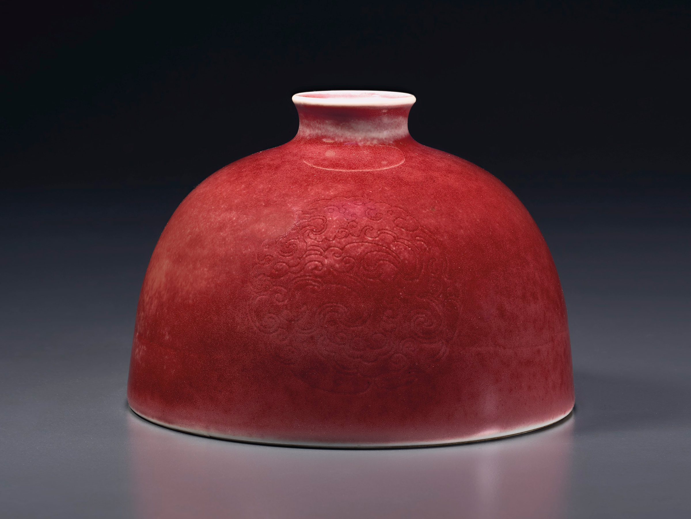 A superb peachbloom-glazed water pot, taibai zun, Kangxi six-character mark in underglaze blue and of the period (1662-1722).&nbsp;4⅞ in (12.4cm) diameter. Estimate: $150,000-250,000. Offered in Sacred and Imperial: The James and Marilynn Alsdorf Collection Part I&nbsp;on 24 September at Christie&rsquo;s in New York
