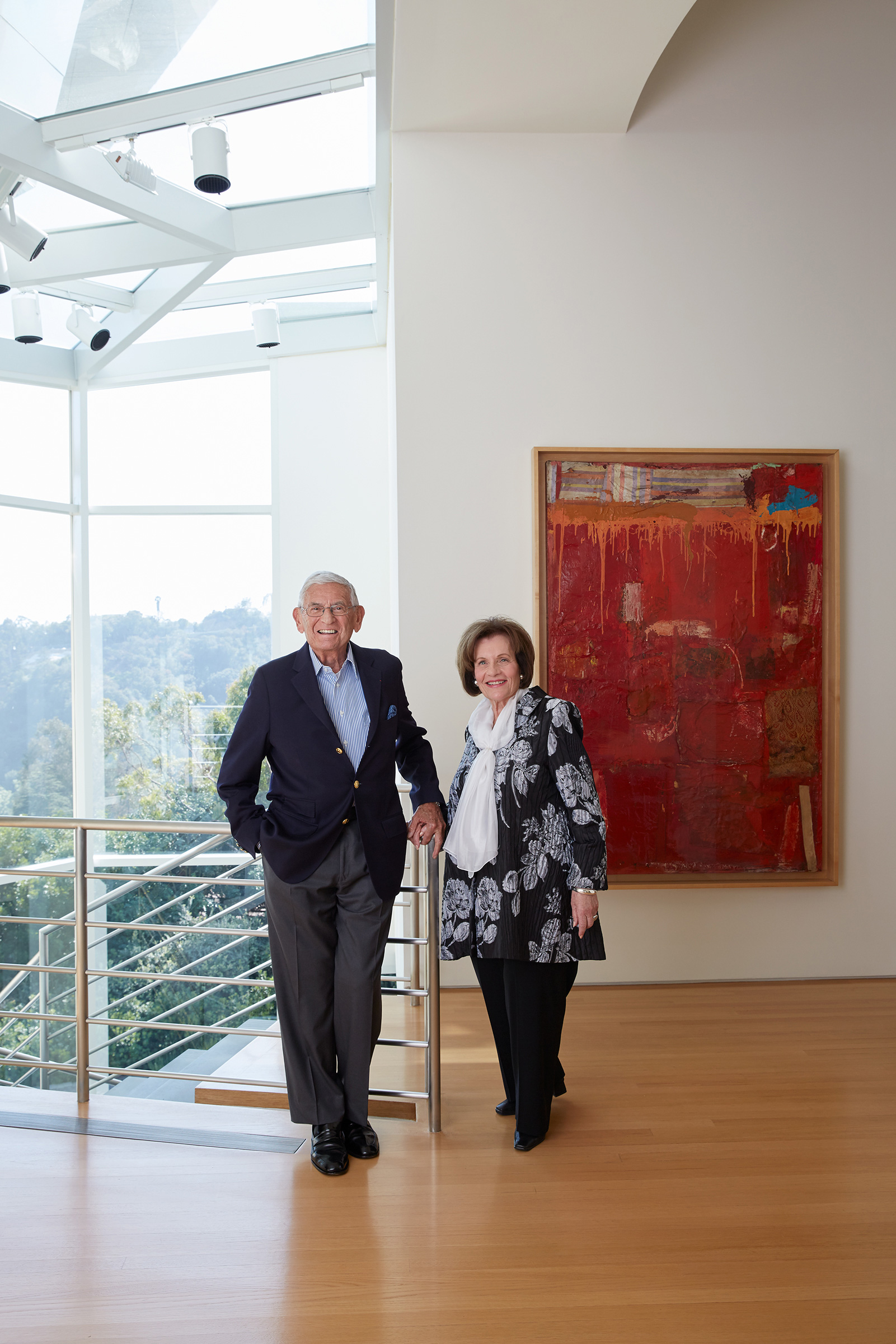Eli and Edythe Broad at their home, with Robert Rauschenberg, Untitled, 1954. Portrait by Roger Davies courtesy of Architectural Digest. Artwork: © Robert Rauschenberg Foundation/VAGA at ARS, NY and DACS, London, 2020