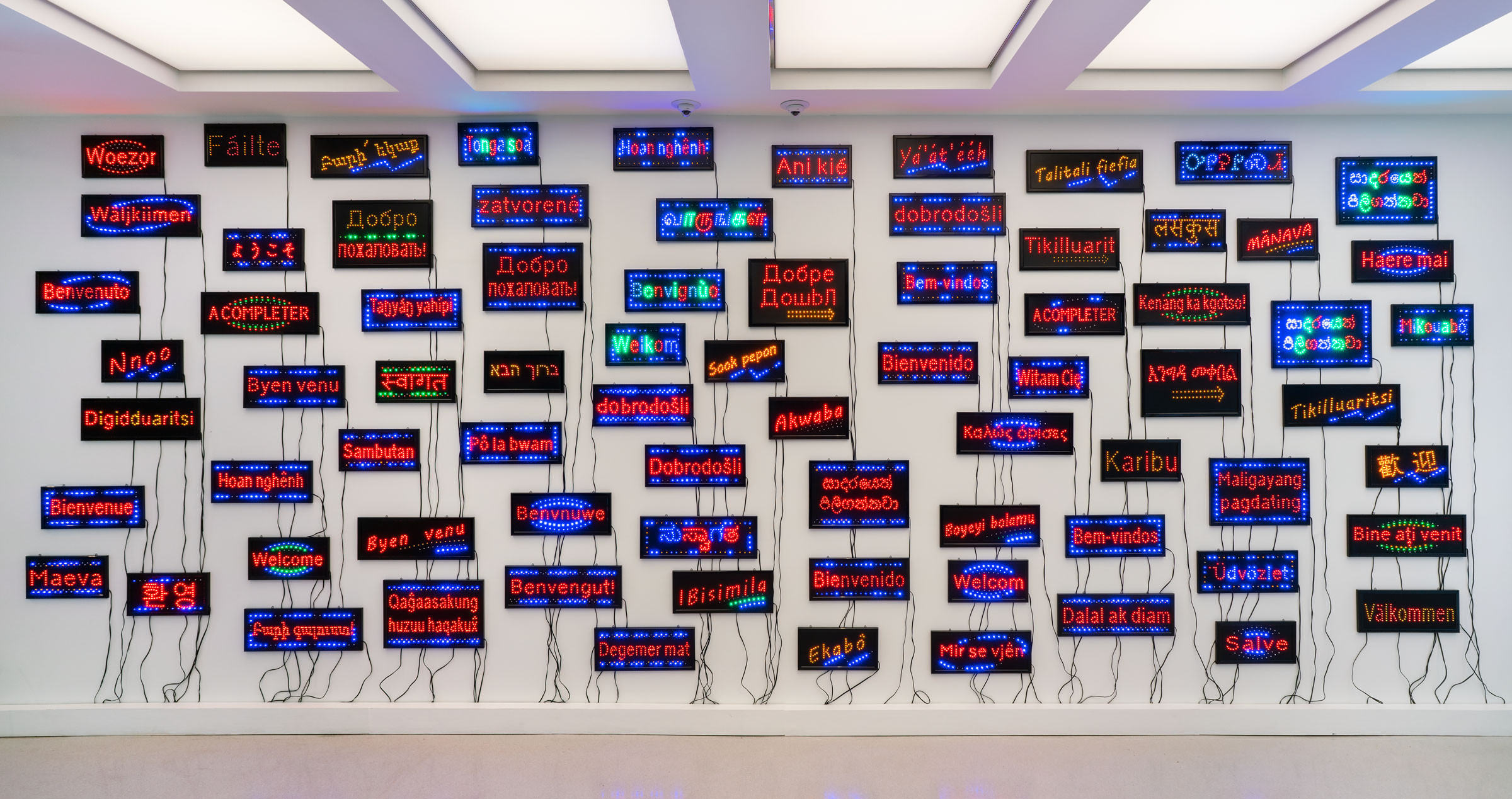Pascale Marthine Tayou, Welcome Wall, 2015. 75 LED signs. Dimensions variable. Collection of The Bass. Purchased through the John and Johanna Bass Acquisition Fund. Photo: Zachary Balber