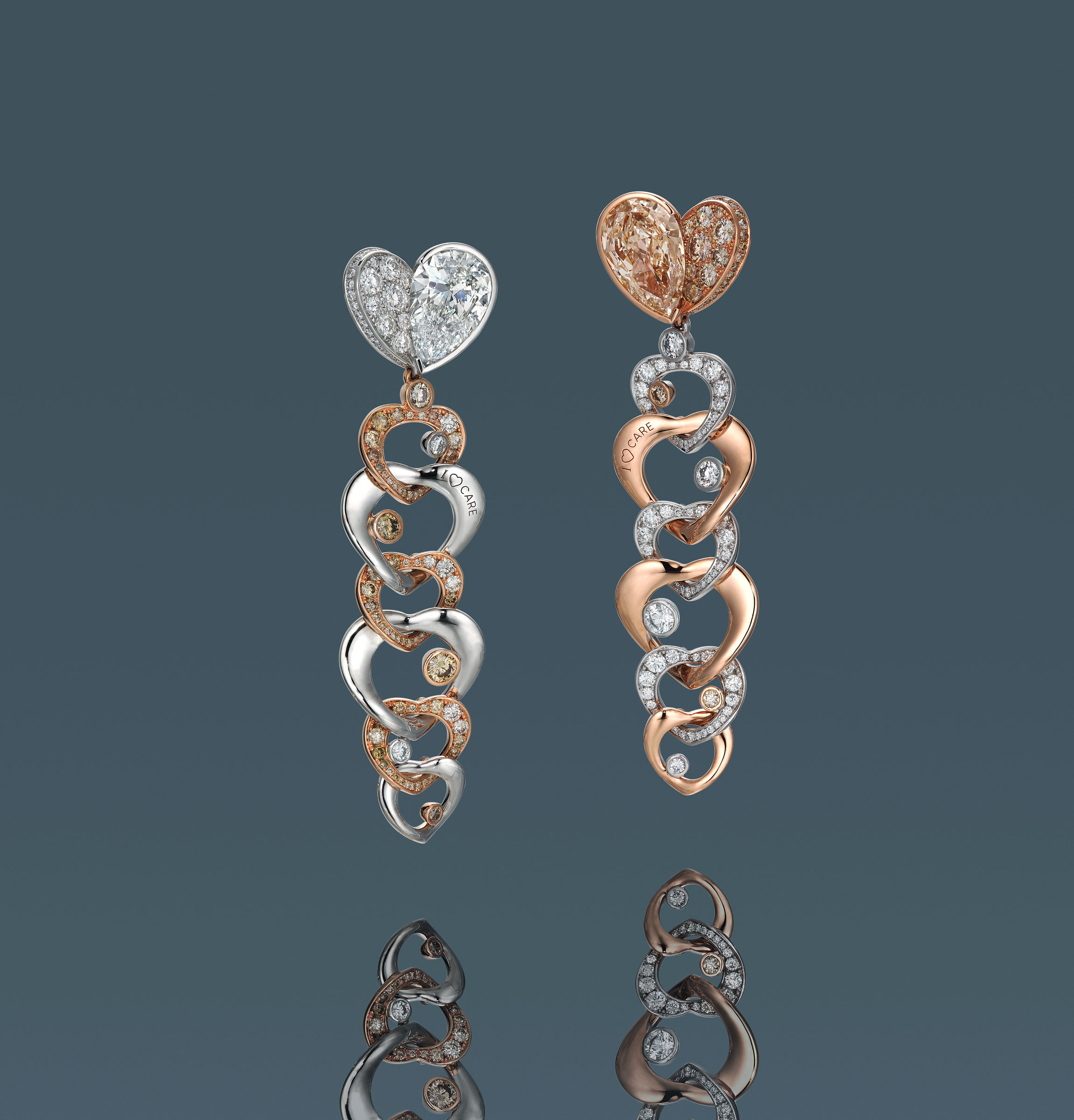 A pair of fancy colour diamond and diamond earrings designed by Anna Hu. Estimate: HK$200,000-300,000. Offered in Diamonds that Care, 3-13 July 2020, Online