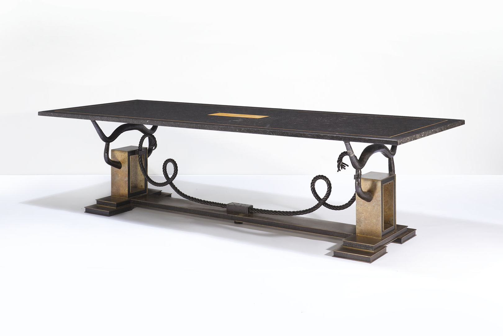 Marc du Plantier (1901-1975), ‘Cornes’ dining table, c. 1950. Gilt-patinated wrought iron, Belgian granite top with yellow Sienna marble inlays. 76 x 288 x 110 cm (30 x 113⅜ x 43¼ in). Estimate: €200,000-300,000. Offered in Design on 2 December 2020 at Christie’s in Paris