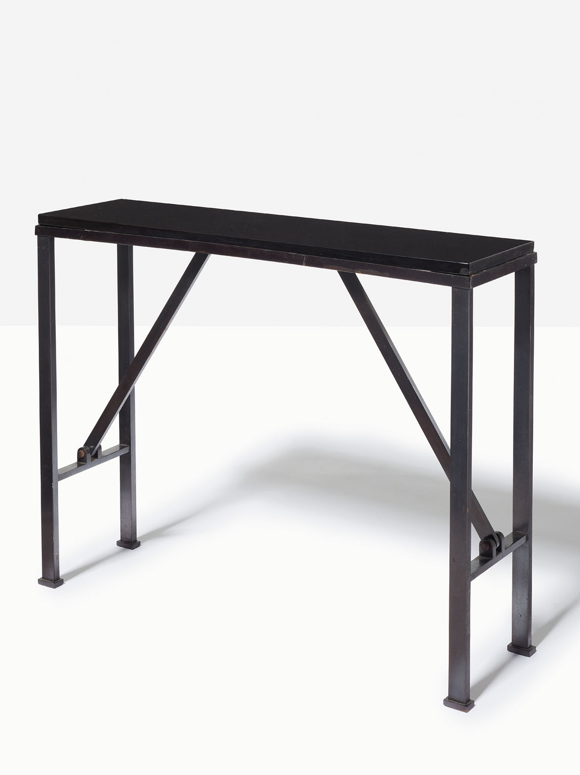 Marc du Plantier (1901-1975), Console, c. 1954. Patinated wrought iron and Belgian black marble. 70.5 x 90 x 25 cm (27¾ x 35½ x 9⅞ in). Estimate: €20-000-30,000. Offered in Design on 2 December 2020 at Christie’s in Paris