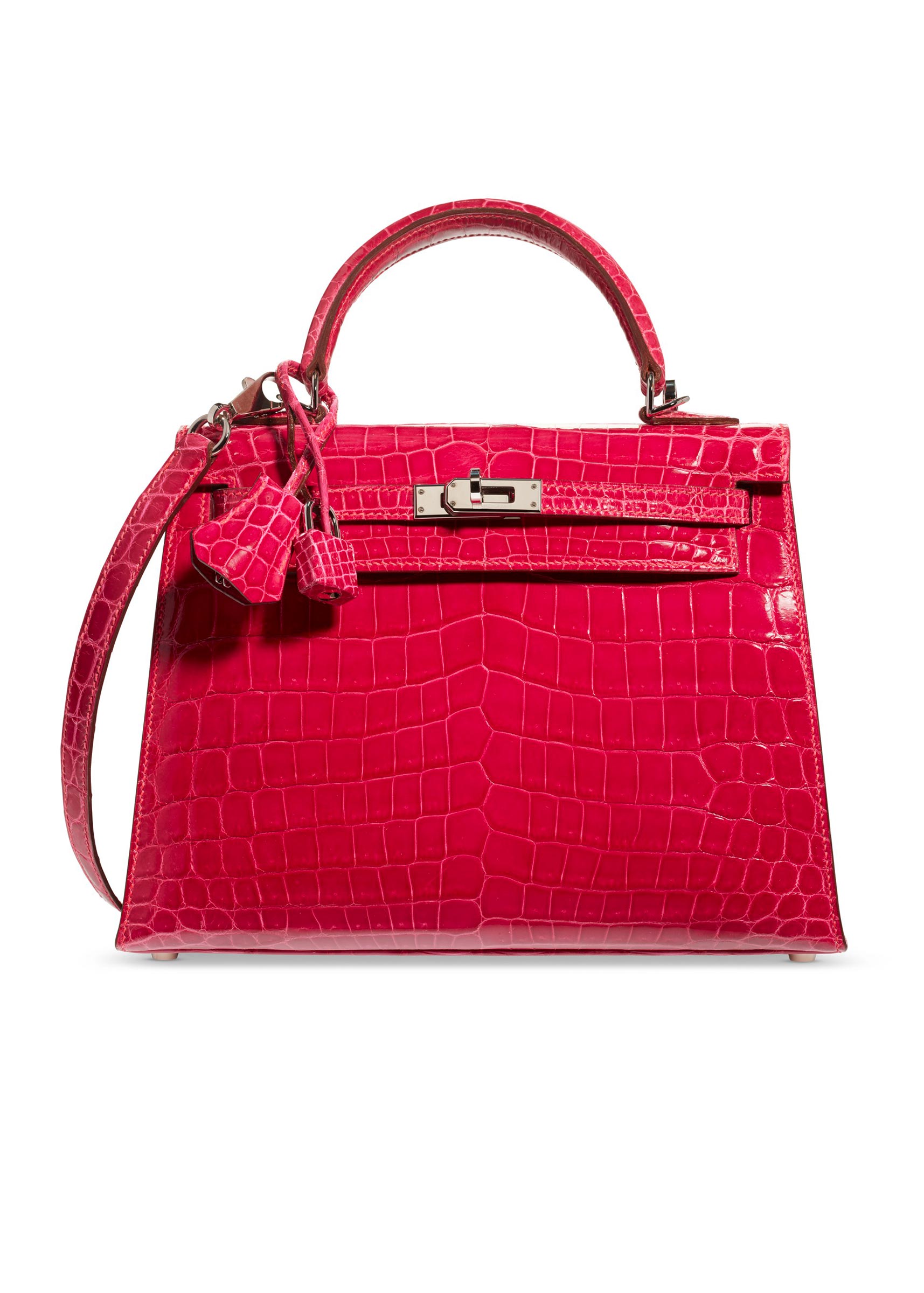 A shiny fuchsia niloticus crocodile sellier Kelly 25 with palladium hardware, Hermès, 2005, from the collection of Susan Casden. 25 w x 18 h x 9 d cm. Sold for $56,250 in Handbags & Accessories Online: The New York Edition, 24 November-10 December 2020, Online