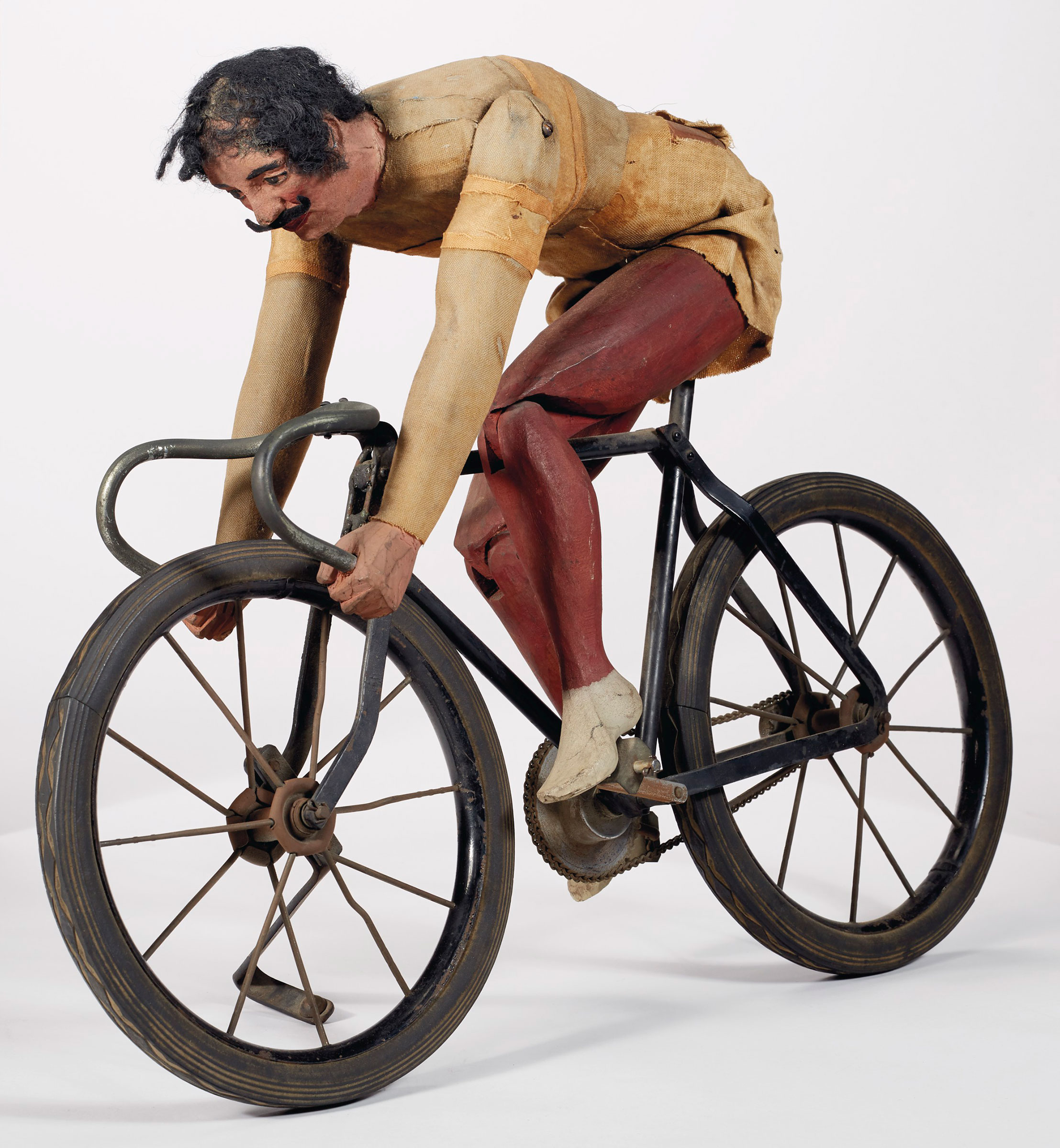 An articulated painted pine and fabric cyclist, probably New York City, early 20th century. 21&frac14; in long, 15&frac12; in high, 4&frac34; in wide. Sold for $13,750 on 22 January 2021 at Christie&rsquo;s in New York