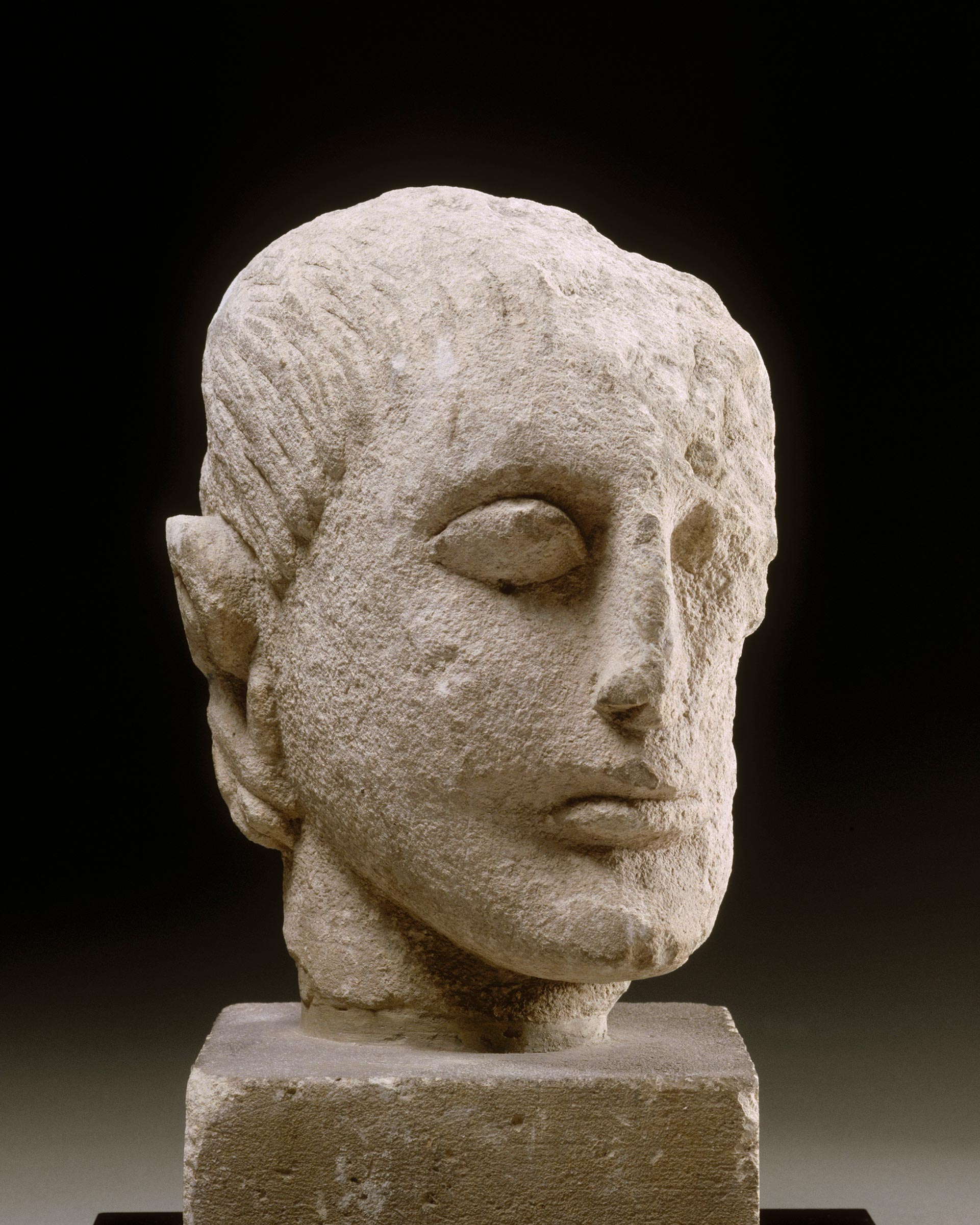 Iberian limestone sculpture of a man&rsquo;s head, 3rd century BC. Photo: &copy; RMN-Grand Palais (mus&eacute;e du Louvre) / Franck Raux