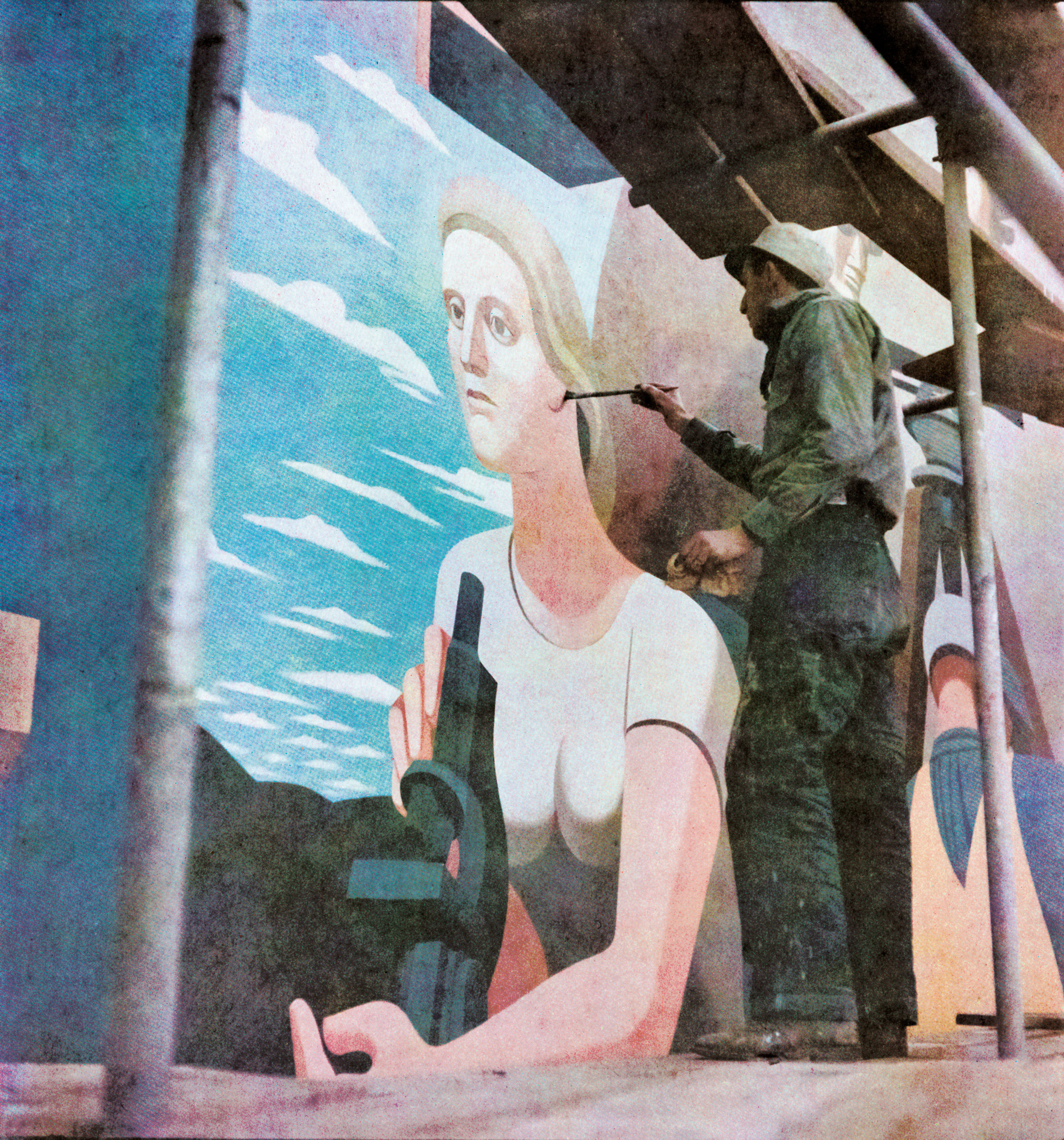 Guston painting his mural Work the American Way, 1939. © The Estate of Philip Guston