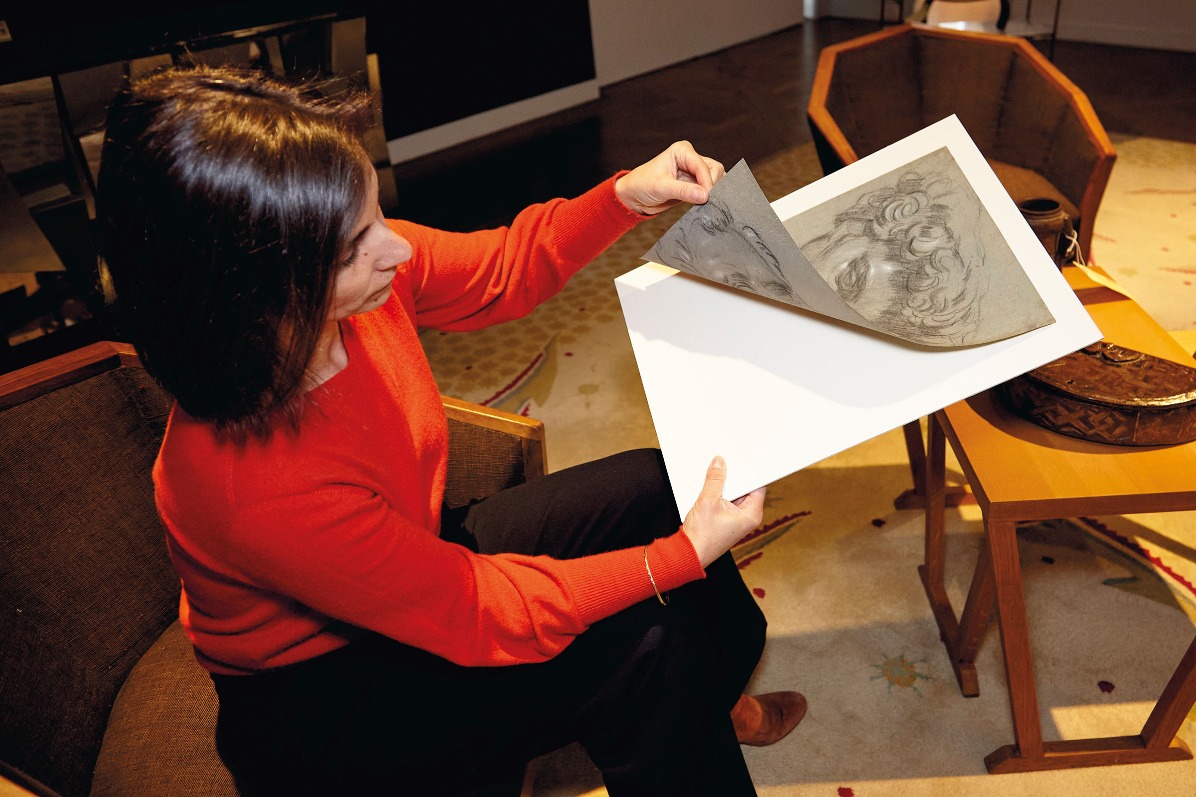 Christie’s specialist Hélène Rihal handling the double-sided drawing from Tintoretto’s workshop