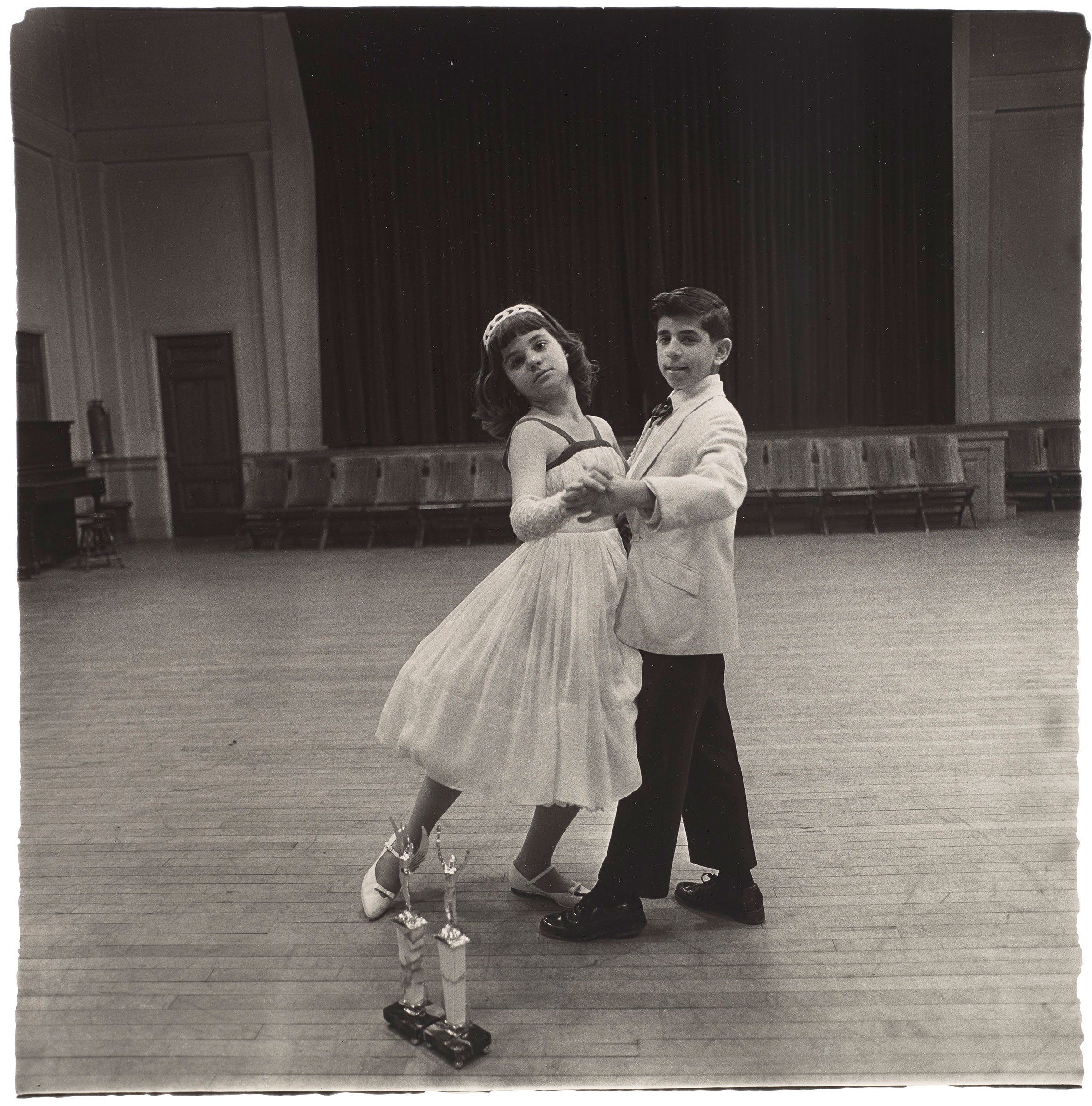 Diane Arbus (1923-1971), The Junior Interstate Ballroom Dance Champions, Yonkers, NY, 1962. Gelatin silver print, printed later by Neil Selkirk. Image: 14½ x 14½ in (36.8 x 36.8 cm); sheet: 20 x 16 in (50.8 x 40.6 cm). Sold for $18,750 on 6 April 2021 at Christie’s in New York
