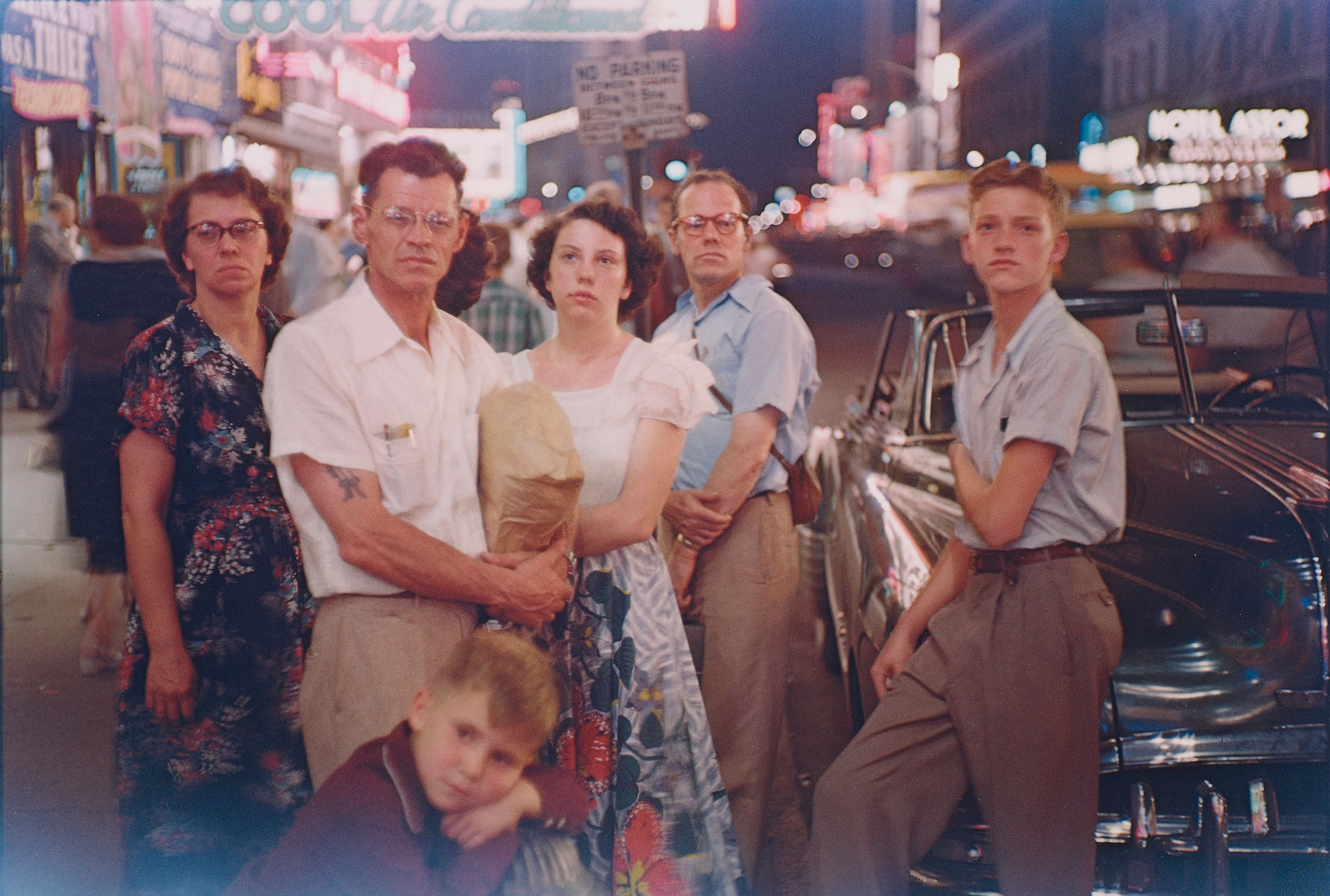 Louis Faurer (1916-2001), Family, Times Square, 1950. Dye-transfer print, printed 1980. Image: 9½ x 13¾ in (24.1 x 34.9 cm); sheet: 16 x 20 in (40.6 x 50.8 cm). Offered on 6 April 2021 at Christie’s in New York
