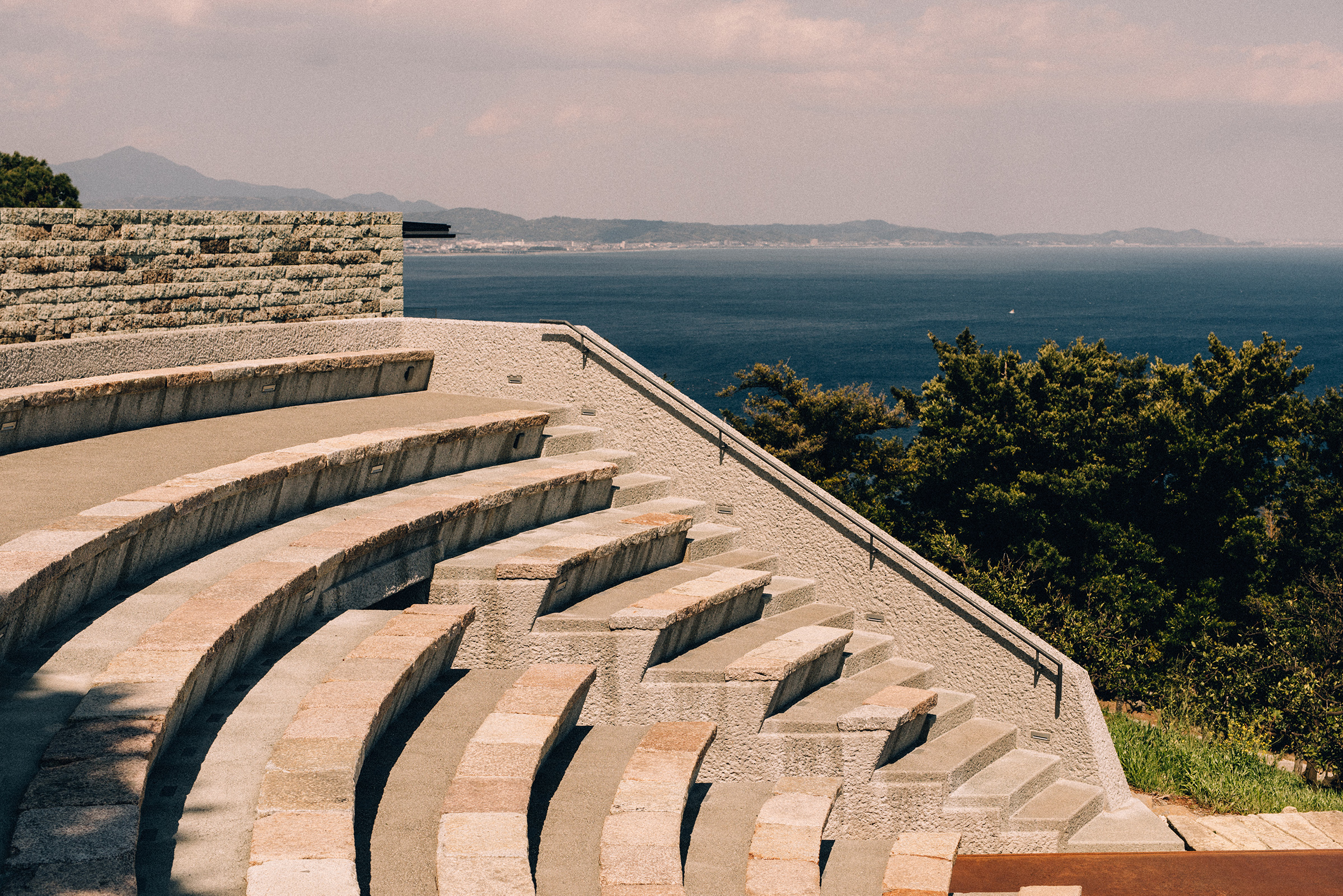 Amphitheatre steps, with a view of the Philippine Sea, descend into the strolling garden. Photograph by Robbie Lawrence