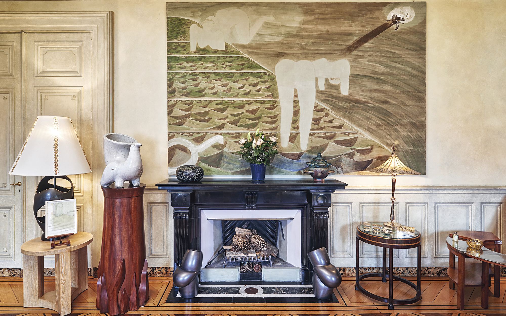 At Marion Lambert’s home, (left to right) ‘La Poule Blanche’, a glazed ceramic garden vase by Georges Jouve, designed in 1949; a unique carved mahogany stand by Marcial Berro, 1993; Thomas Schütte, Pots (5) and Pots (8), glazed ceramic, 2001; a silvered brass table lamp by Dagobert Peche, designed in 1921-22. Photo: © Christie’s Limited 2021
