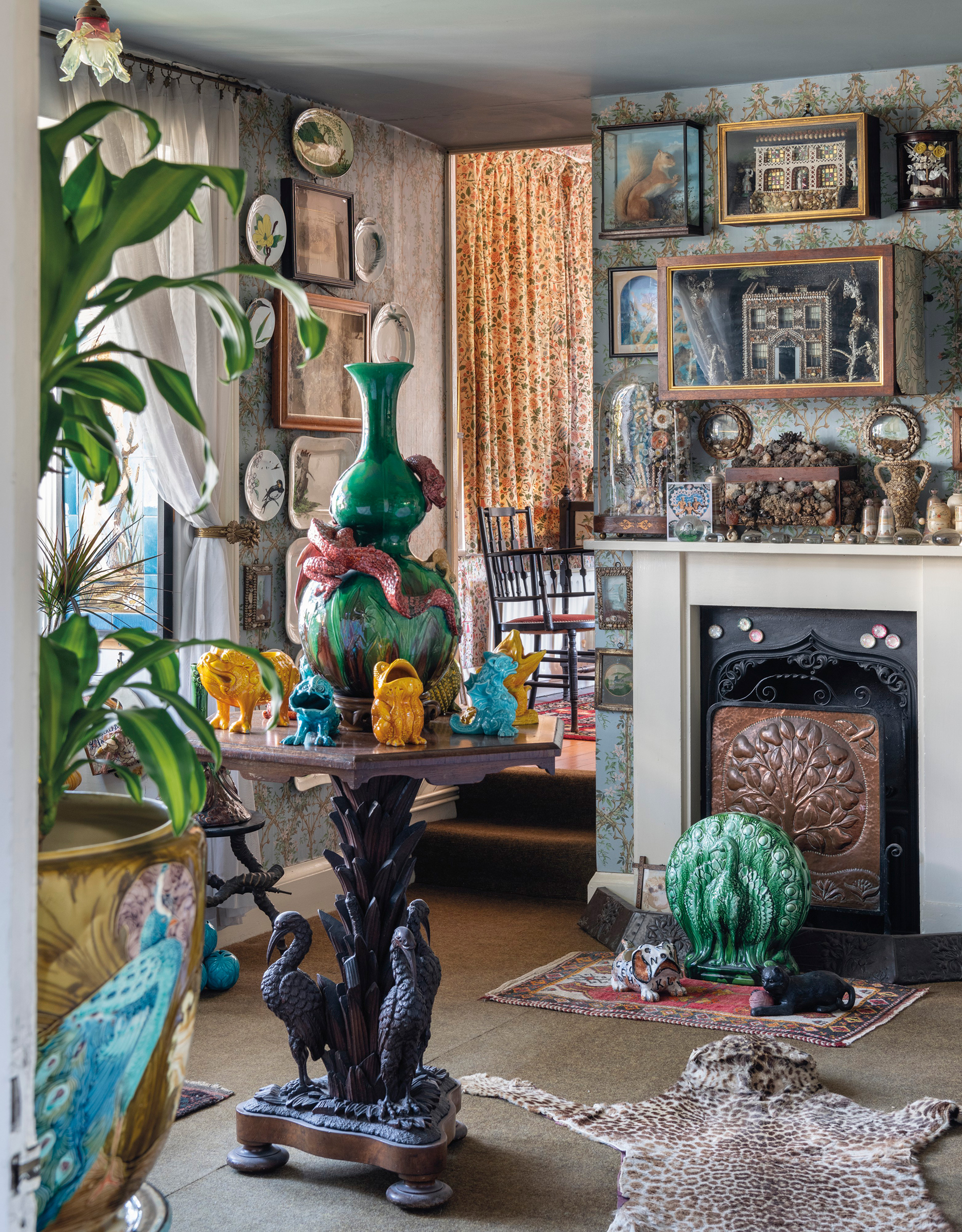 The nature room was a celebration of the most eccentric, colourful and fun Victorian creations, including a Burmantofts dragon-wrapped vase on a table with three herons to support it