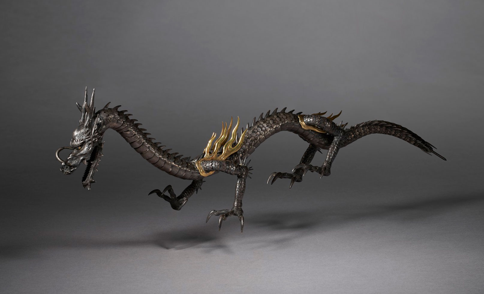 A silver articulated sculpture of a dragon, Meiji period (late 19th century). Estimate: $30,000-40,000. Offered in Important Japanese Art on 21 September 2021 at Christie’s in New York