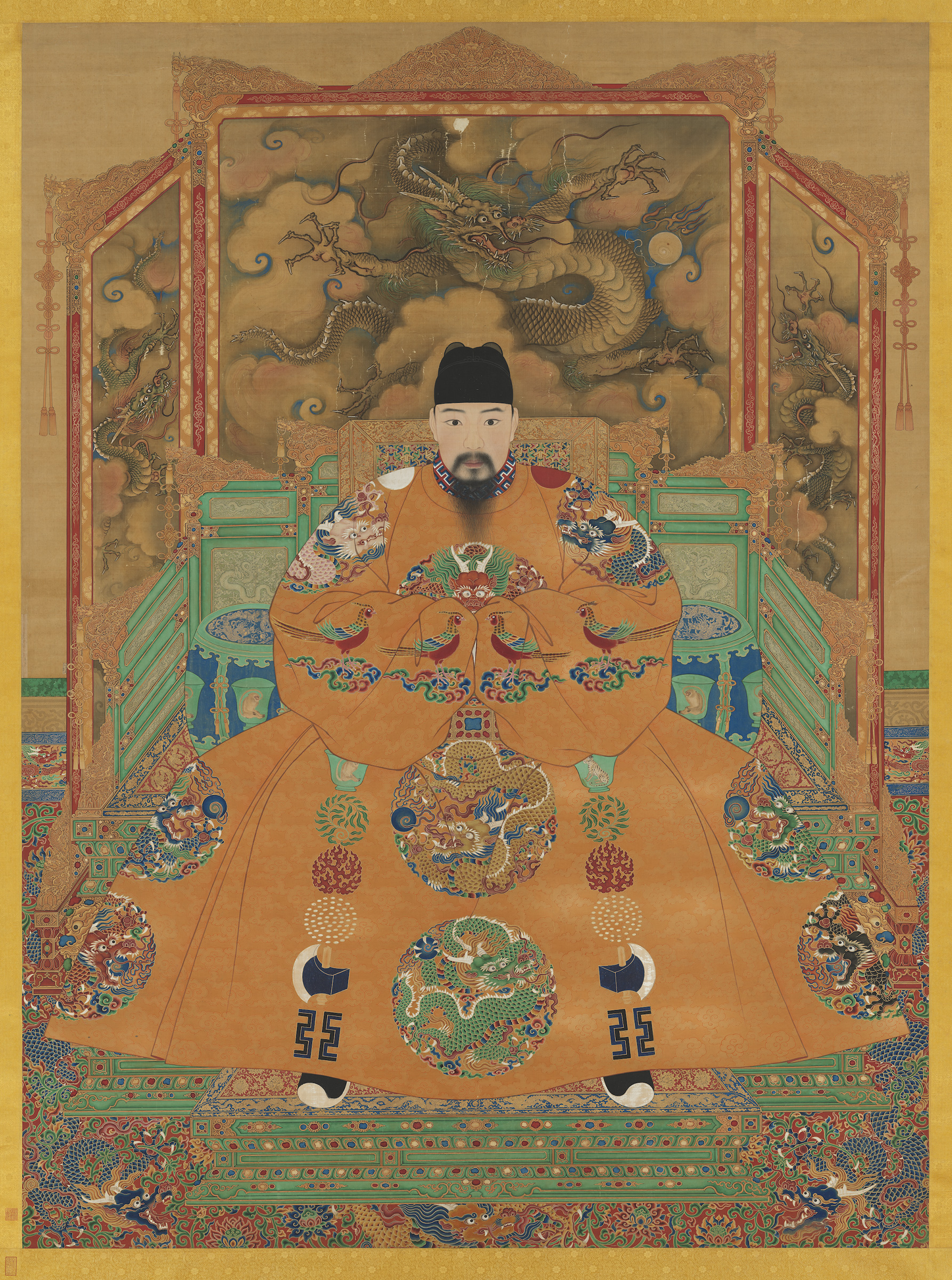 Portrait of the Hongzhi Emperor (r. 1488-1505), in which his throne rests on an imperial Ming carpet with dragon and lotus patterns against a deep red background. Hanging scroll, ink and colours on silk. National Palace Museum, Taipei