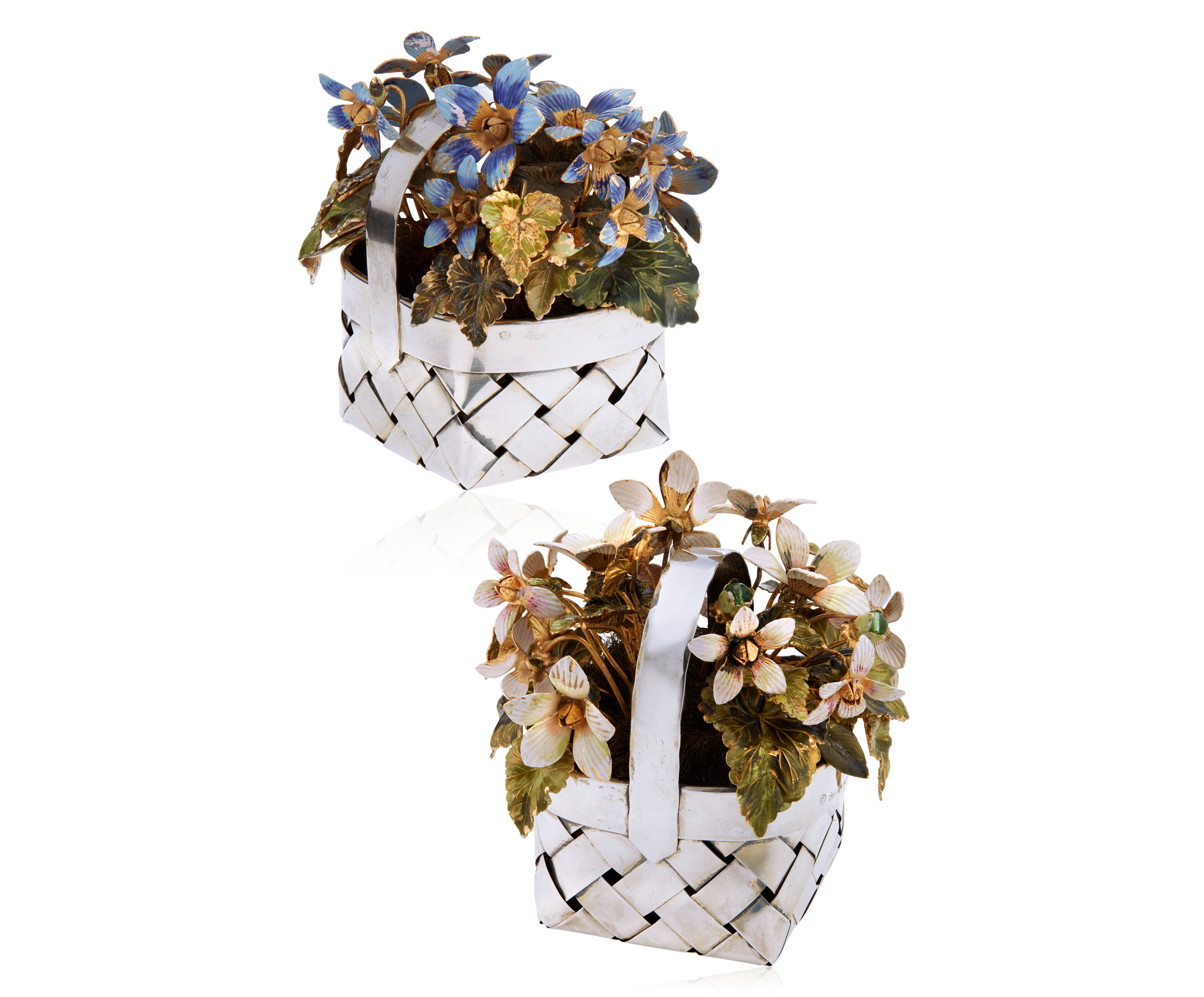 No reserve | Cartier pair of enamel and silver flower baskets. Size/dimensions: each approximately (2⅞ x 2⅝ x 3&frac12; in) 7.4 x 6.6 x 9.0 cm. Estimate: $5,000-7,000. Offered in Jewels Online on 24 January-9 February 2022 at Christie&rsquo;s Online