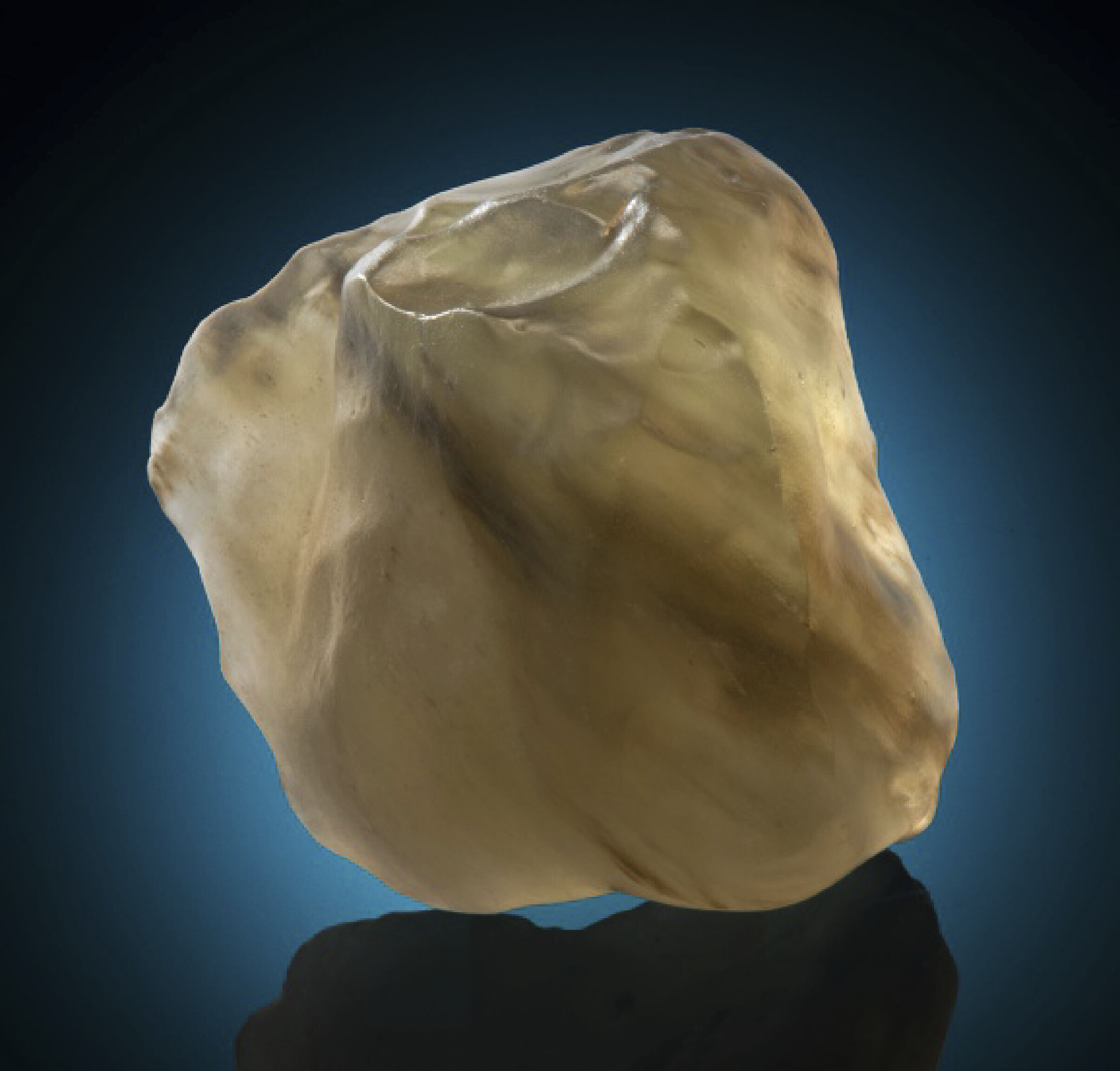 Desert glass from an asteroid impact on Earth. 2.33 x 1.5 x 2.33 in (60 x 40 x 60mm) and 92.8g. Sold for $20,000 on 23 February 2021, Online