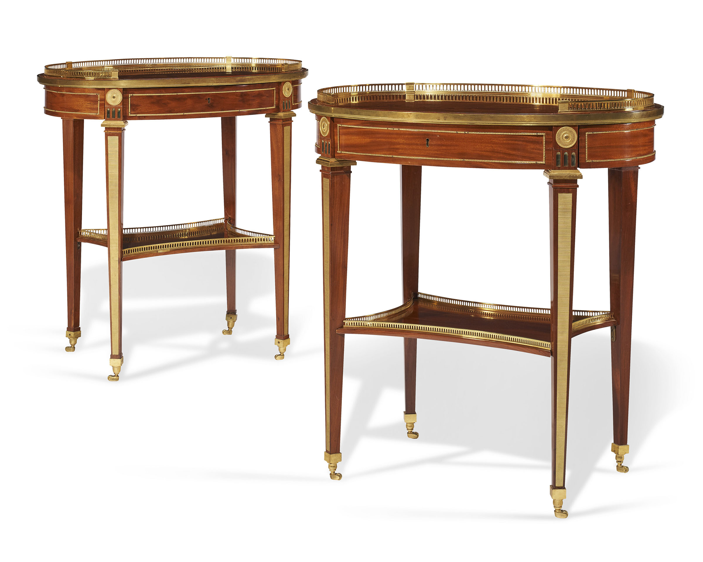 A near pair of German ormolu-mounted mahogany acajou mouchete (plum pudding) mahogany mechanical writing tables, by David Roentgen, c. 1785-92. 30 &frac12; in (77.5 cm) high; 27&frac14; in (69.2 cm) wide; 18&frac14; in (46.4 cm) deep. Estimate: $120,000-180,000. Offered in The Collector: English &amp; European Furniture, Ceramics, Silver &amp; Works of Art from 22 March-5 April 2022 at Christie&rsquo;s Online