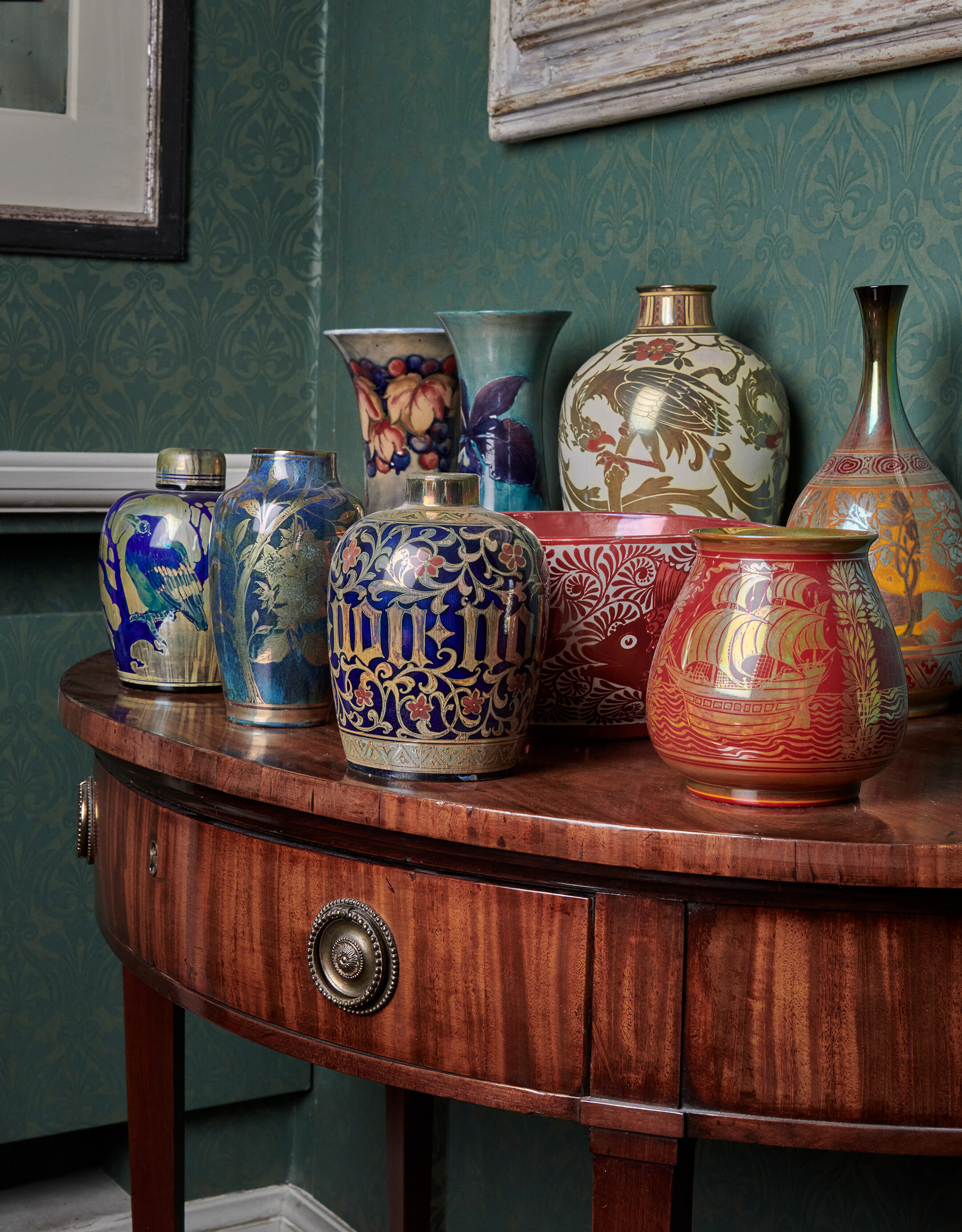 A group of William de Morgan and Pilkington vases at Sir Nicholas Goodison&rsquo;s house. Offered in The Collection of Sir Nicholas Goodison - British Art: Innovation and Craftsmanship on 25 May 2022 at Christie&rsquo;s in London