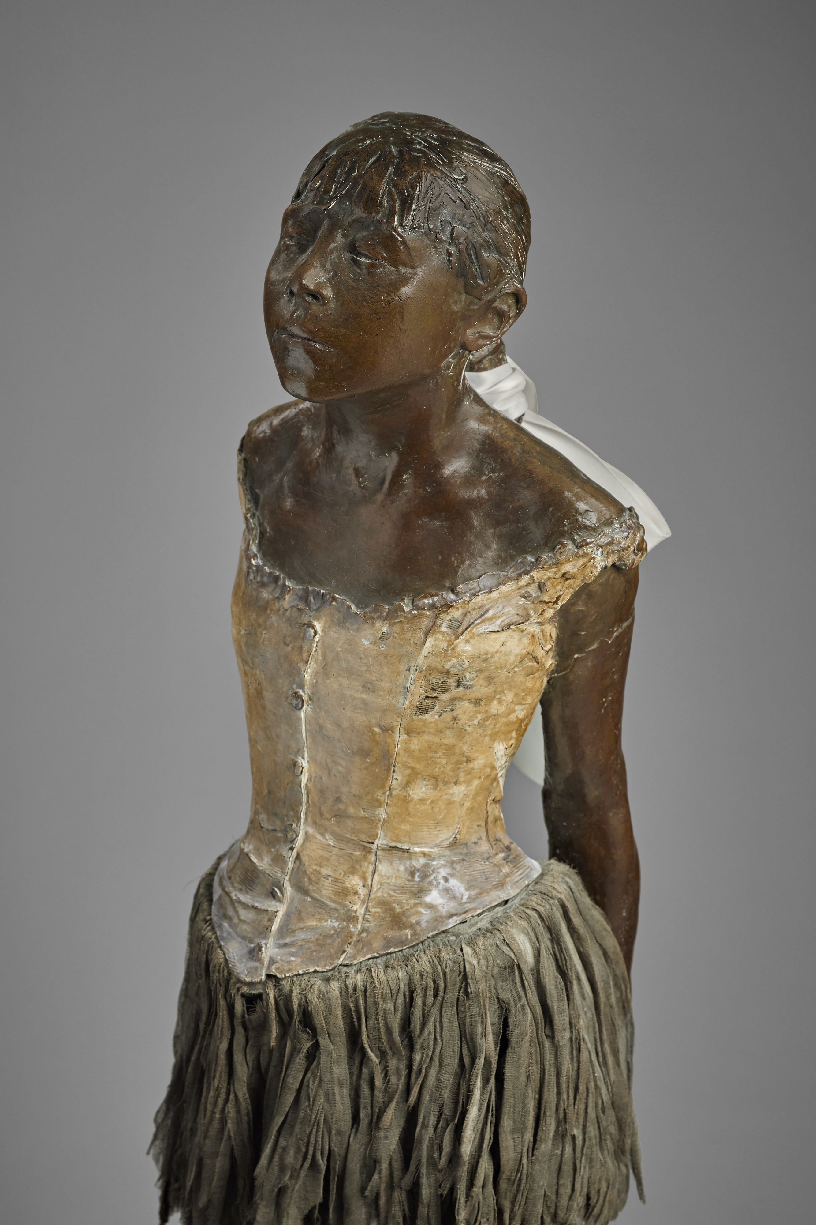 Edgar Degas (1834-1917), Petite danseuse de quatorze ans, cast in 1927. Bronze with brown patina with muslin skirt and satin hair ribbon on wooden base. Height (excluding base): 40½ in (102.9 cm). Estimate: $20,000,000-30,000,000. Offered in The Collection of Anne H. Bass in May 2022 at Christie's in New York