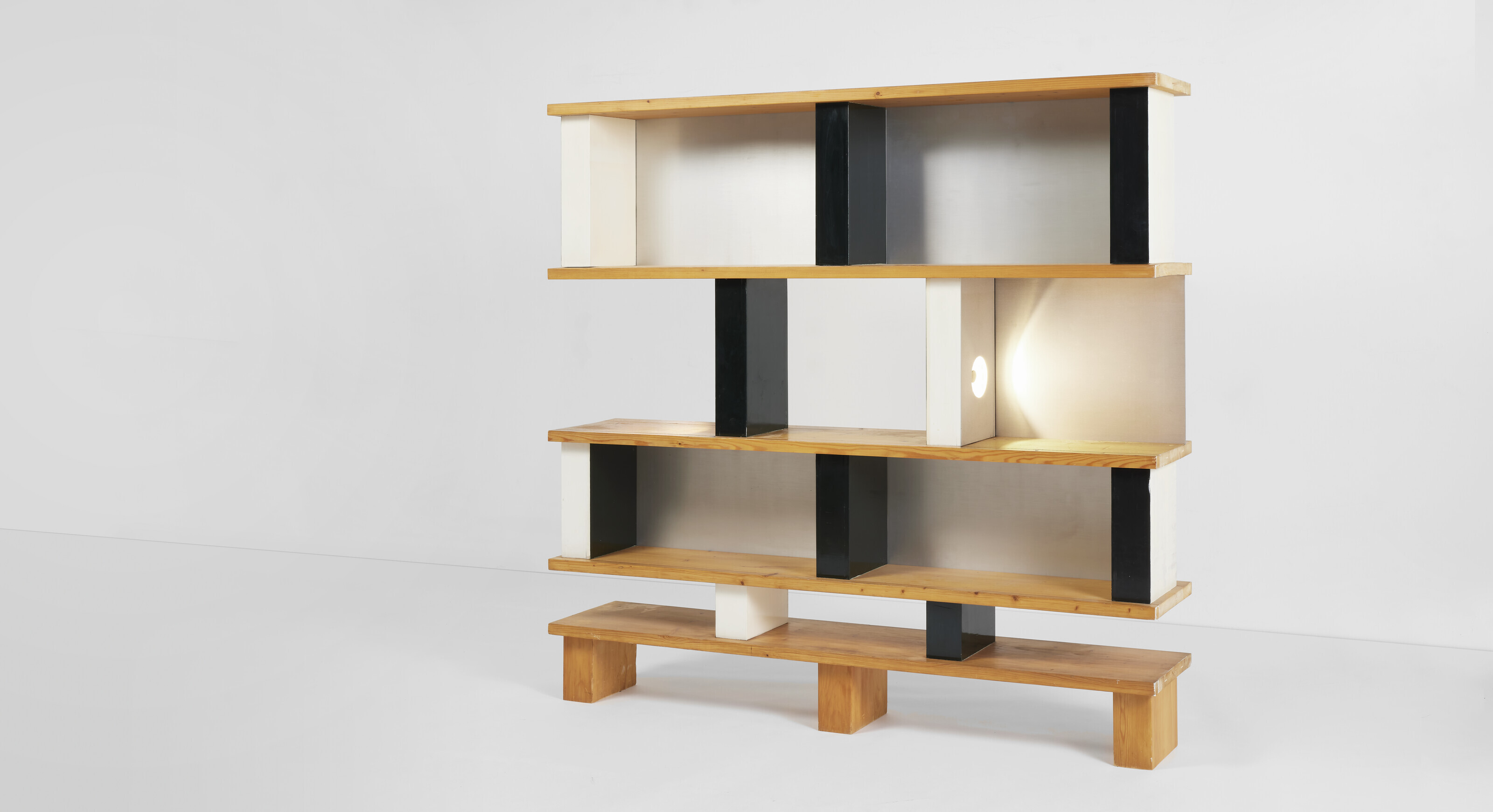 Charlotte Perriand (1903-99), Biblioth&egrave;que plots bookcase, as seen at 18 rue Las Cases, Paris, 1986. Photo: Jacques Barsac / Archives Charlotte Perriand / &copy; Adagp, Paris, 2022. Painted fir, fir and aluminium. 66&frac12; x 67⅞ x 13 in (169 x 172.5 x 33 cm). Estimate: &euro;150,000-200,000. Offered in Design on 25 May 2022 at Christie's in Paris
