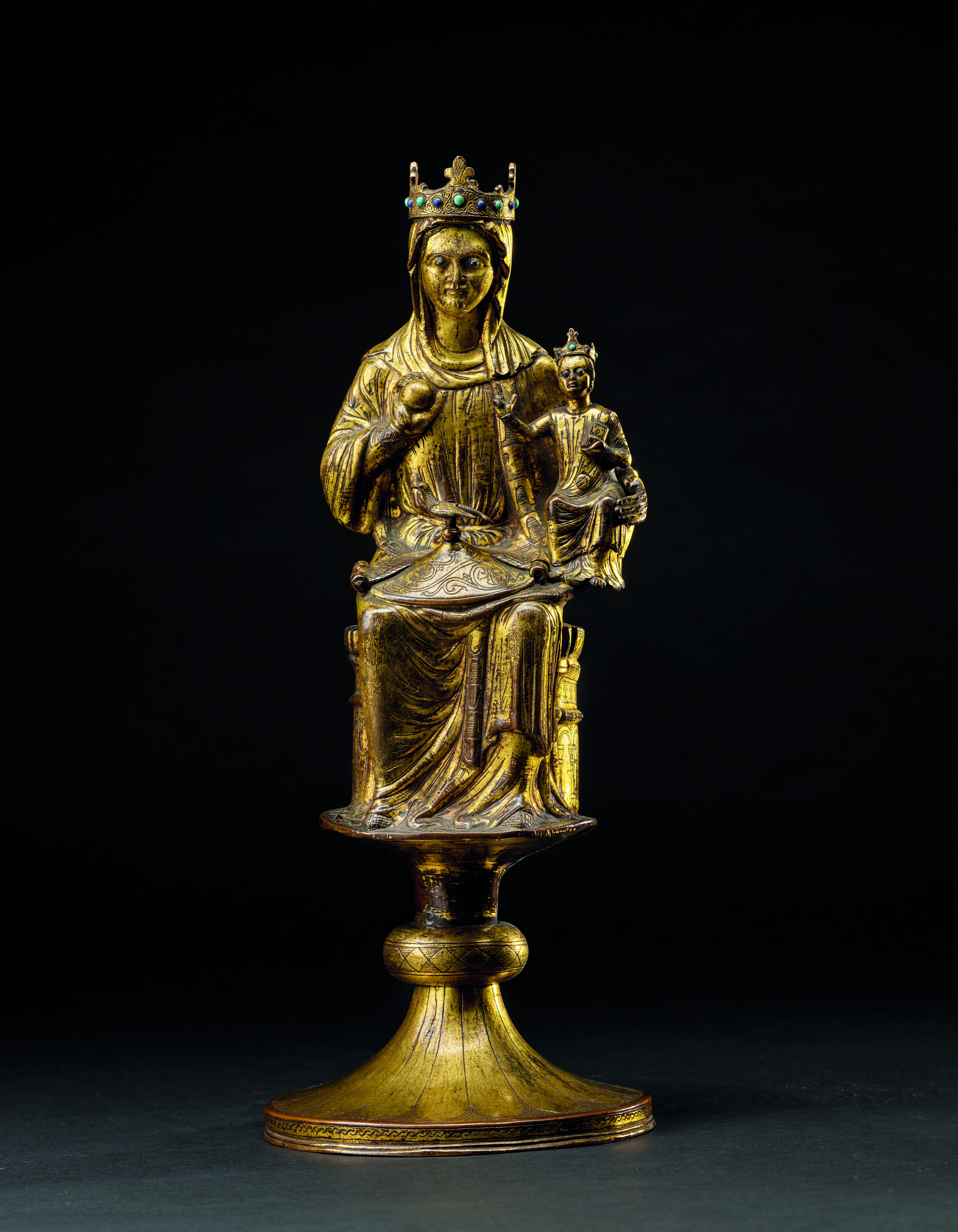 An engraved gilt-copper pyxis representing the Virgin and Child, second half of the 13th century. Embossed, chiselled, engraved and gilded copper with glass beads. 13⅗ in (34.5 cm) high. Estimate: €500,000-700,000. Offered in Maîtres Anciens - Dessins, Peintures, Sculptures on 18 May 2022 at Christie's in Paris