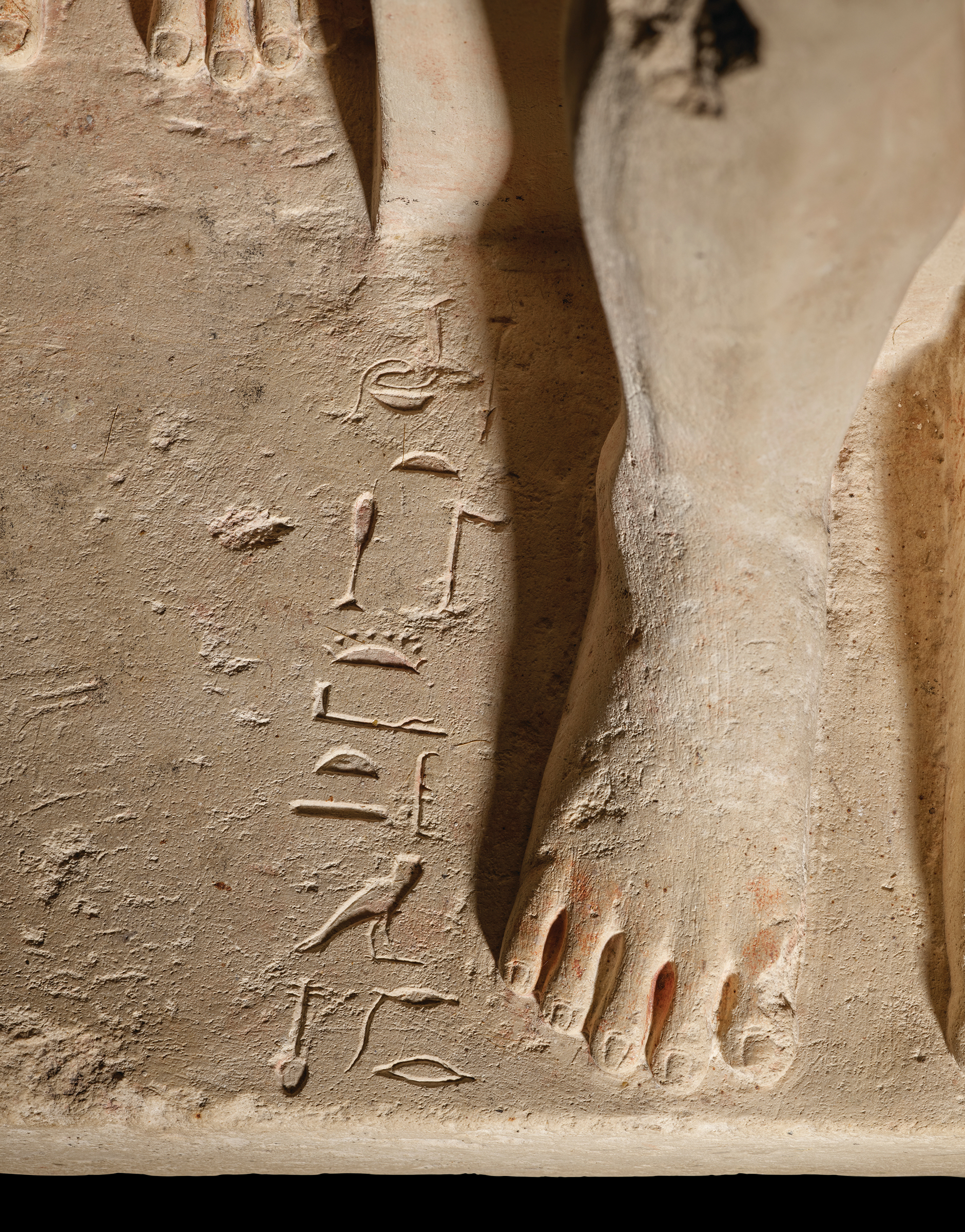 Detail of an inscription on the base of the sculpture