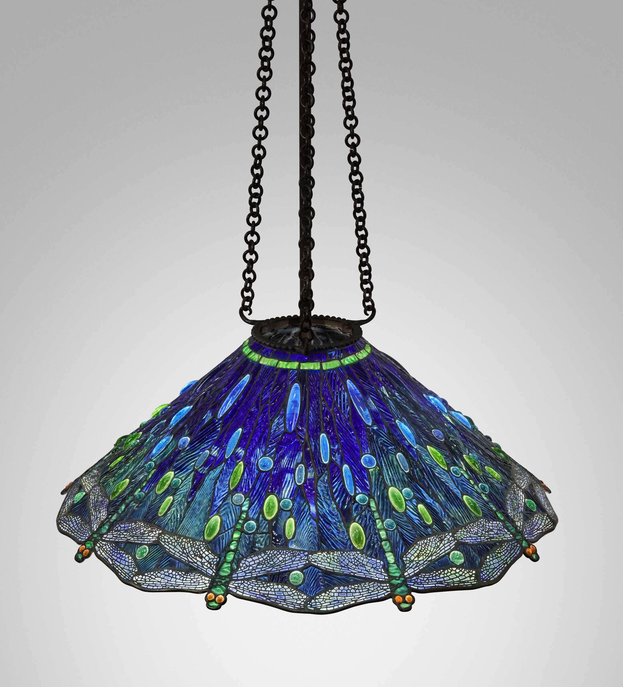 Tiffany Studios, Important and rare 'Hanging Head Dragonfly' chandelier, c. 1905. Leaded glass, patinated bronze. 10½ in (26.7 cm) high, 28 in (71.1 cm) diameter, 60 in (152.4 cm) drop. Sold for $1,008,000 in Tiffany Masterworks from the Garden Museum: A Private Collection on 10 June 2022 at Christie's in New York