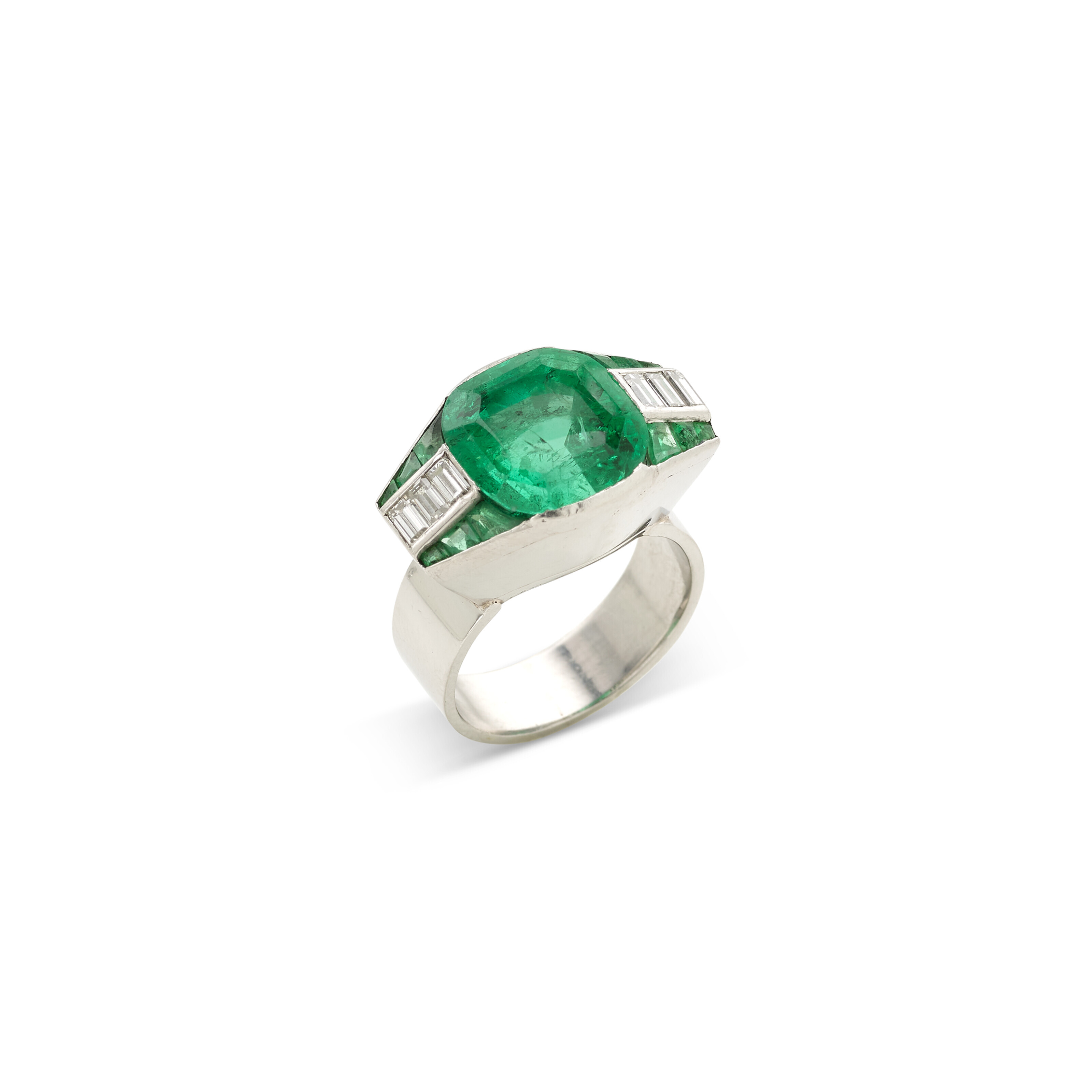 Georges Fouquet (1899-1984), Platinum, emerald and diamond ring. Main emerald: approx. 8.6 carats. Approx. 11.75 x 11.20 x 10.10 mm. 13.2 grams. Estimate: &euro;30,000-50,000. Offered in Joaillerie Paris, 23 June to 7 July, Online