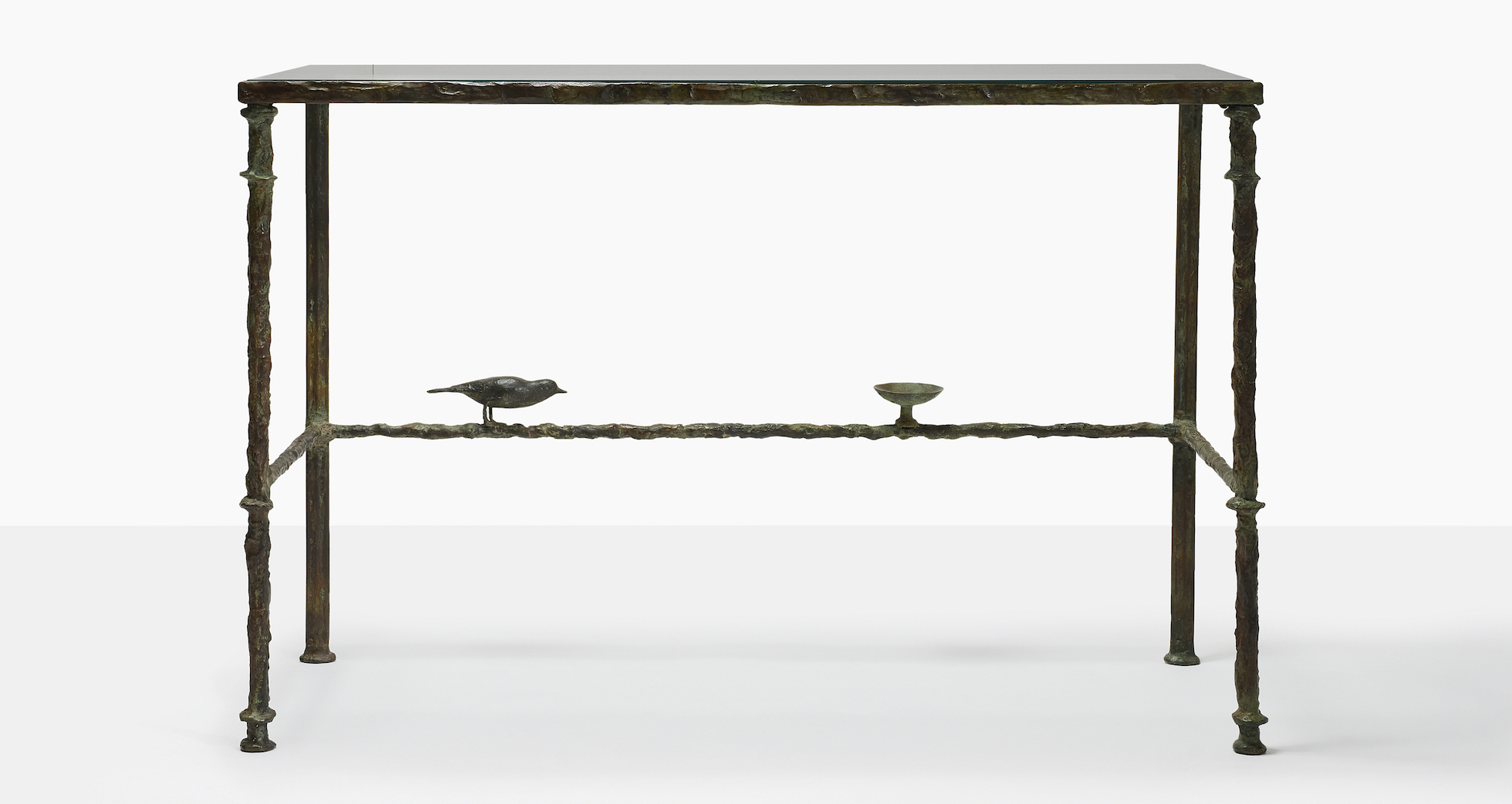 Diego Giacometti (1902-1985), Console bird and cup, circa 1976. Patinated bronze, painted wrought iron and glass. Height: 31&frac12; in (80 cm); Length: 47⅘ in (121.5 cm); Depth: 20⅕ in (51.5 cm). Sold for &euro;1,662,000 on 14 June at Christie&rsquo;s in Paris