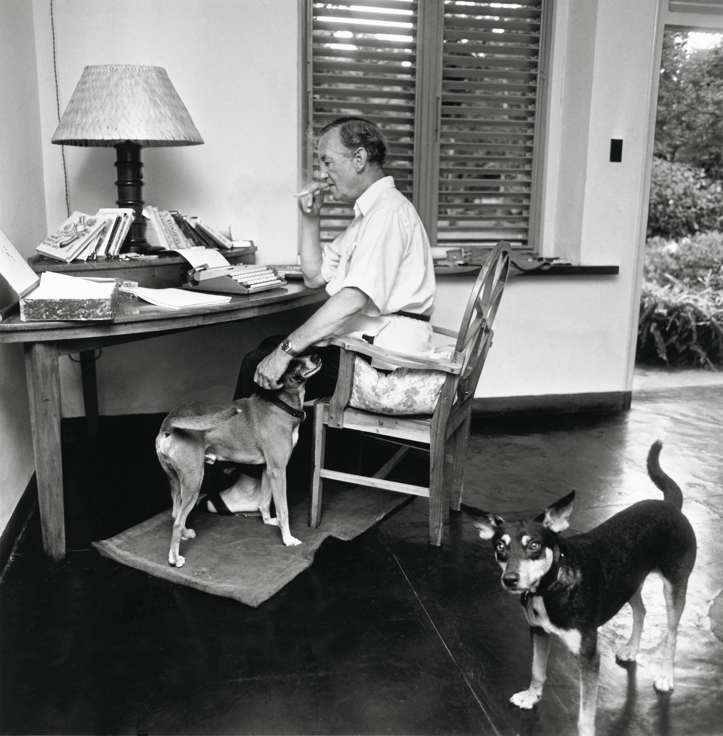 Ian Fleming at his desk in the villa at GoldenEye, where he wrote all 14 of the Bond books. Photo: © 2000-2006 Heidelberger Druckmaschinen AG. All Rights Reserved